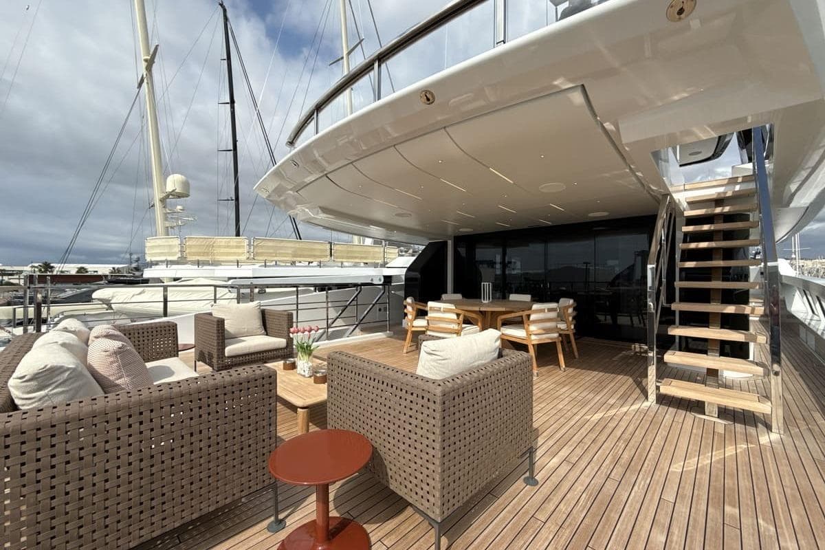 Luxurious 2023 Sanlorenzo 44Alloy yacht deck with elegant seating and dining area.