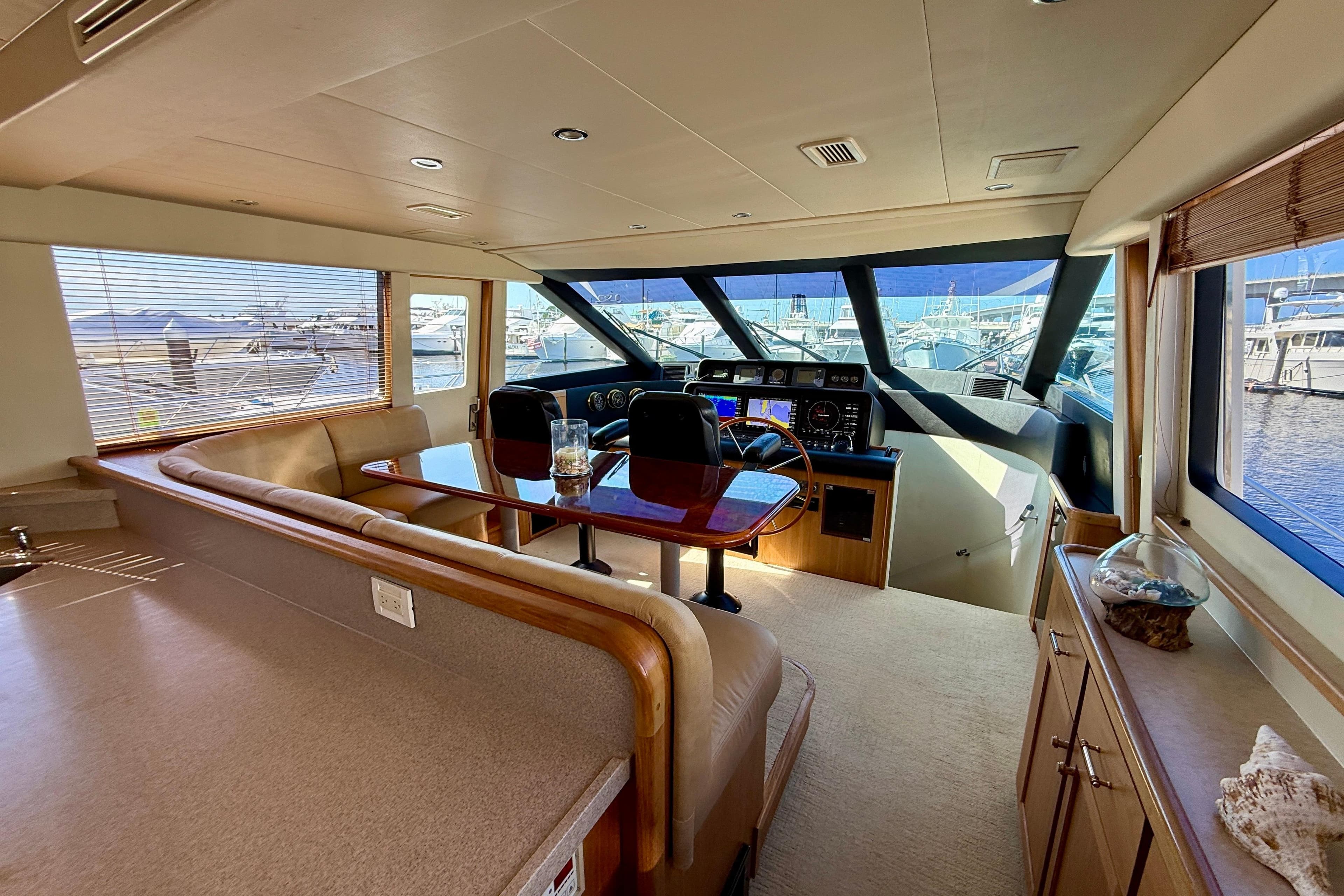 Luxurious interior of a 2001 Pacific Mariner 65 Motoryacht with helm and seating area.