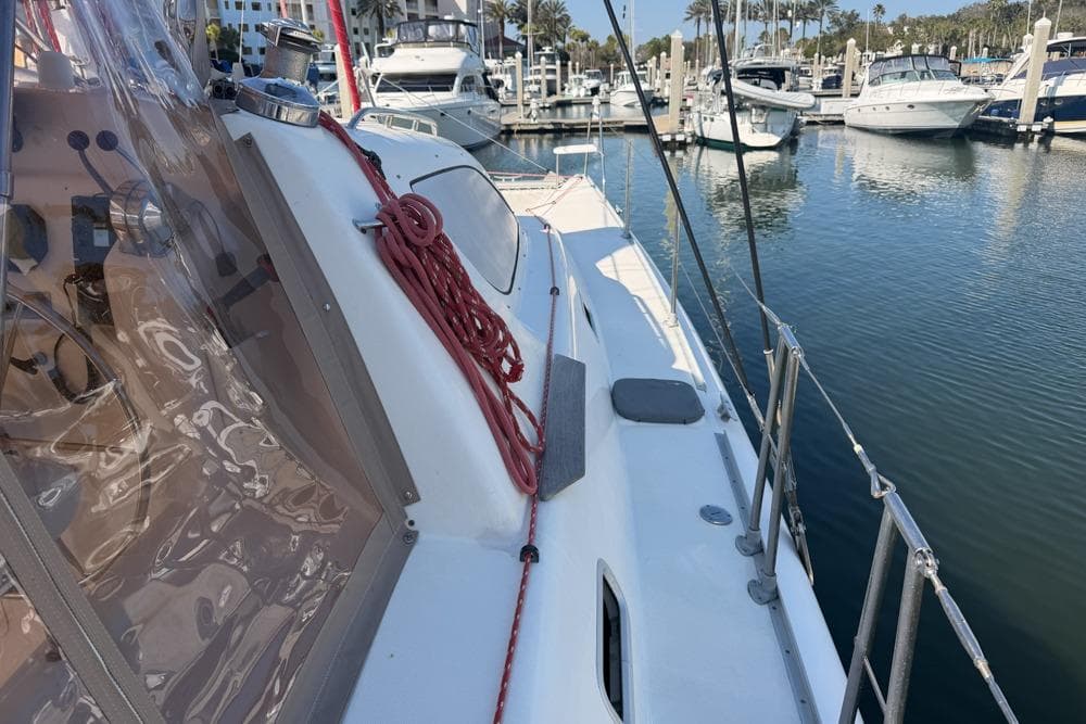 Leopard 38 catamaran docked in marina, showcasing deck and rigging, 2000 model.
