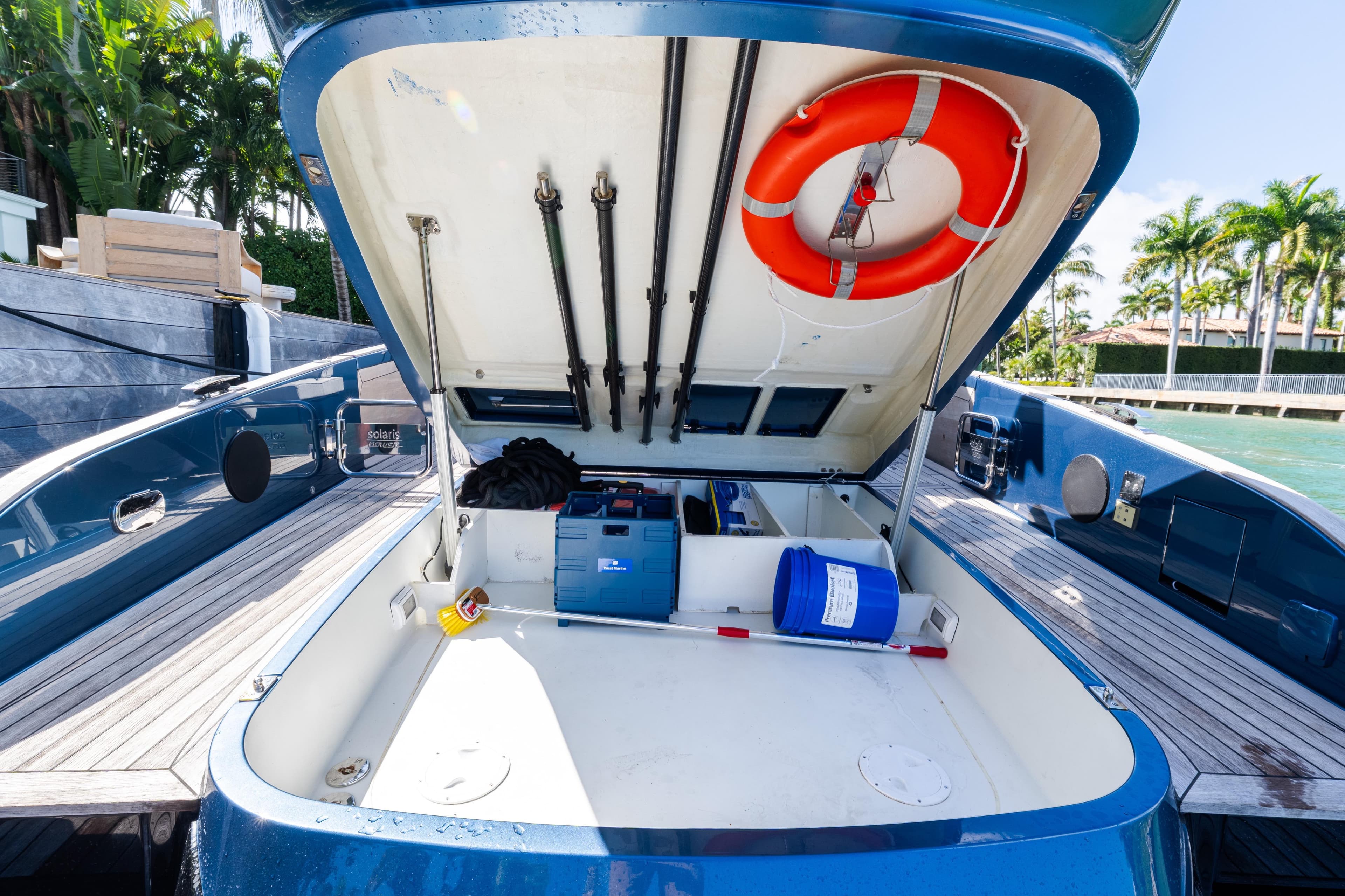 2023 Solaris Power 44 Open yacht storage compartment with life preserver and equipment.