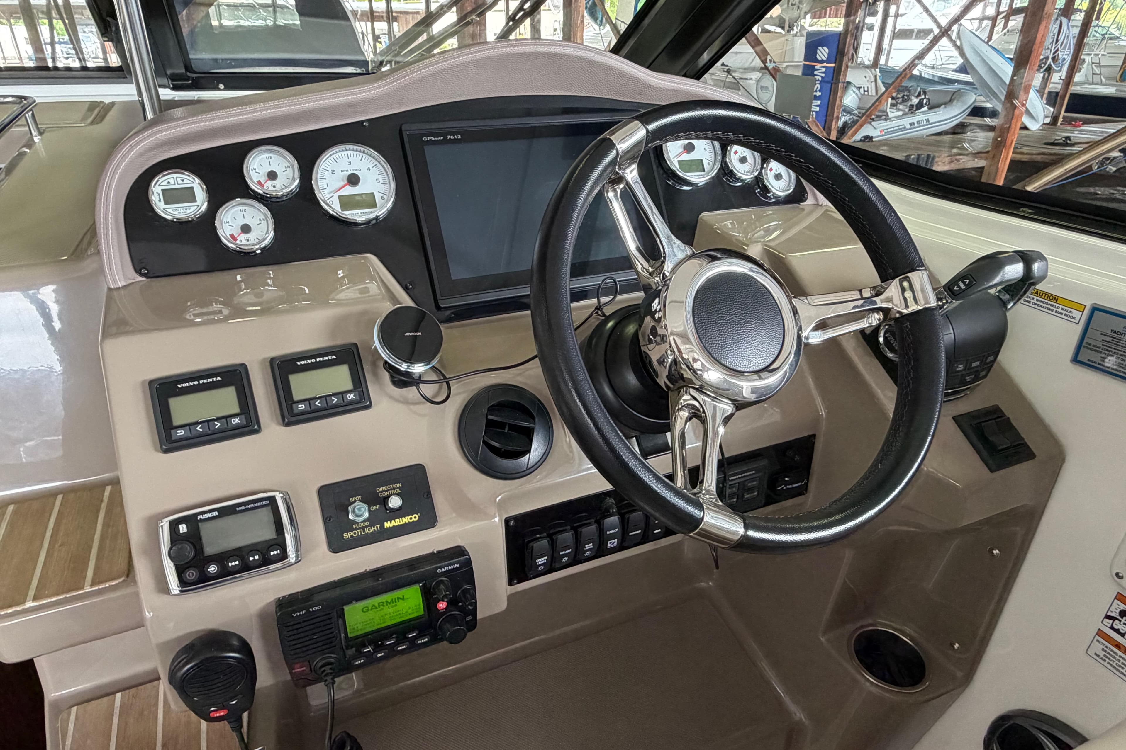Cockpit of 2016 Regal 35 Sport Coupe with steering wheel and control panel.