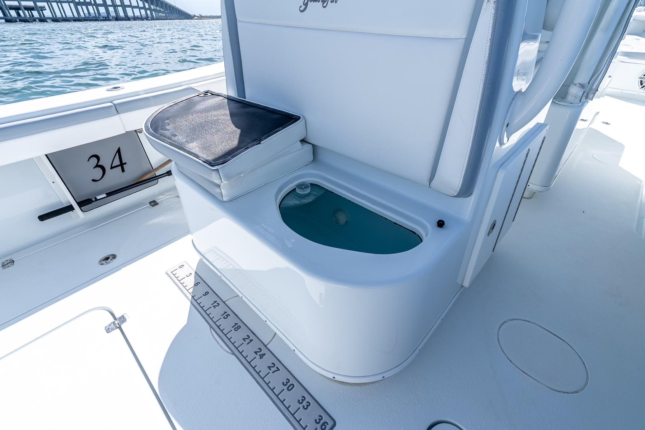 2021 Yellowfin 34 boat interior with livewell and measuring ruler on deck.