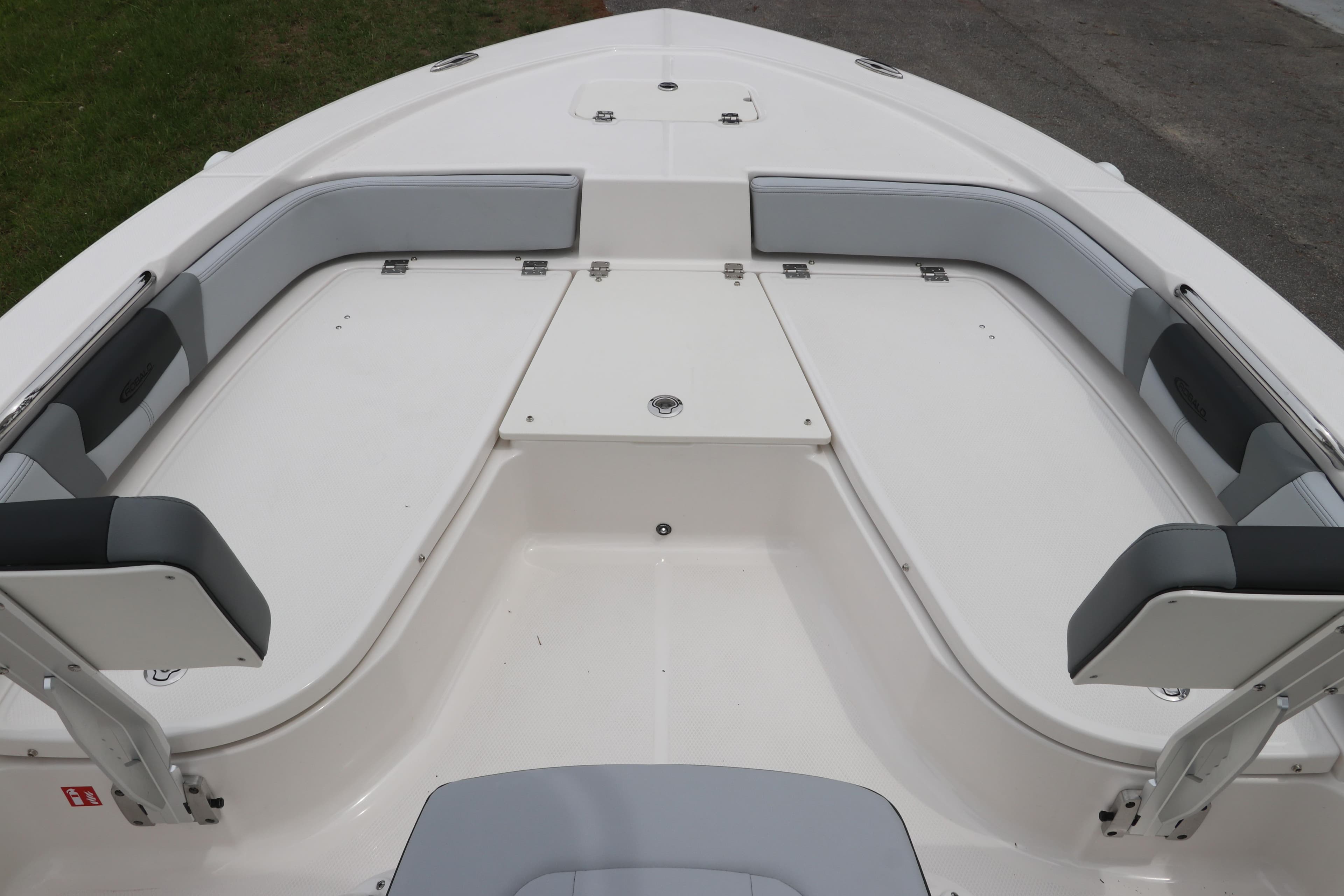 2026 Robalo 206 Cayman boat interior with cushioned seating and storage compartments.