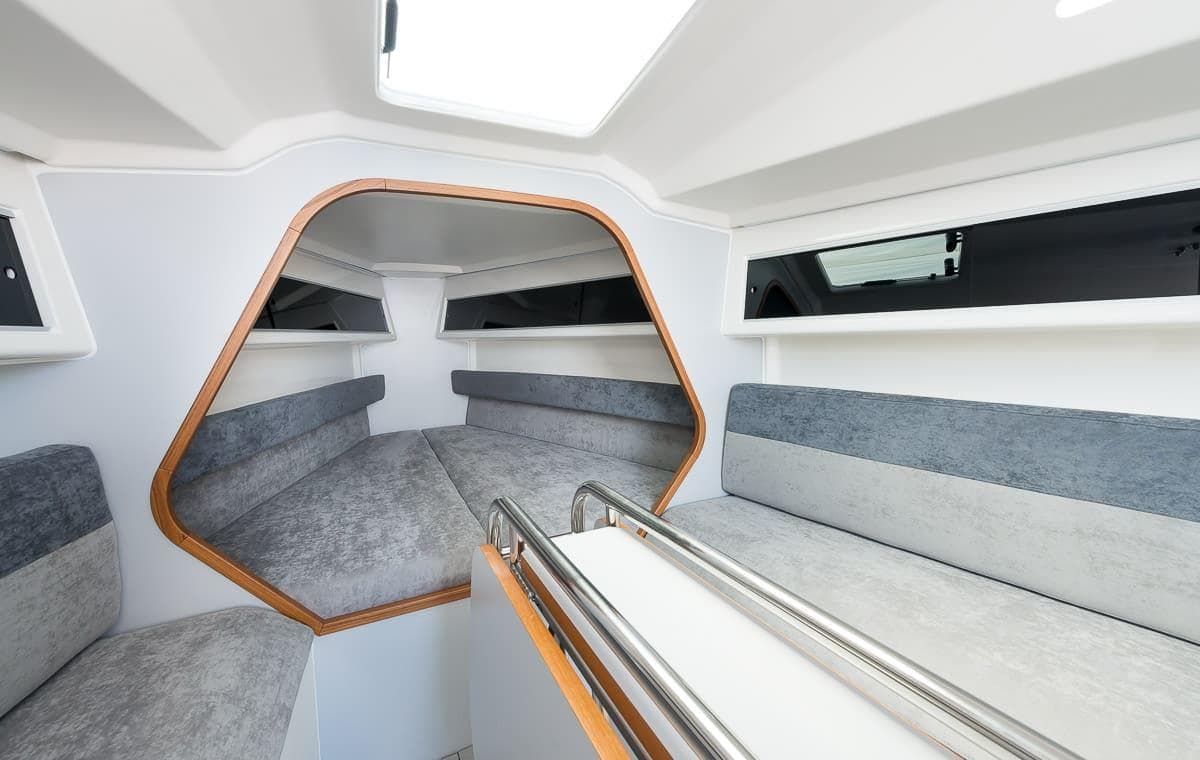 Italia Yachts IY 9.98 2026 interior cabin with modern seating and sleek design.