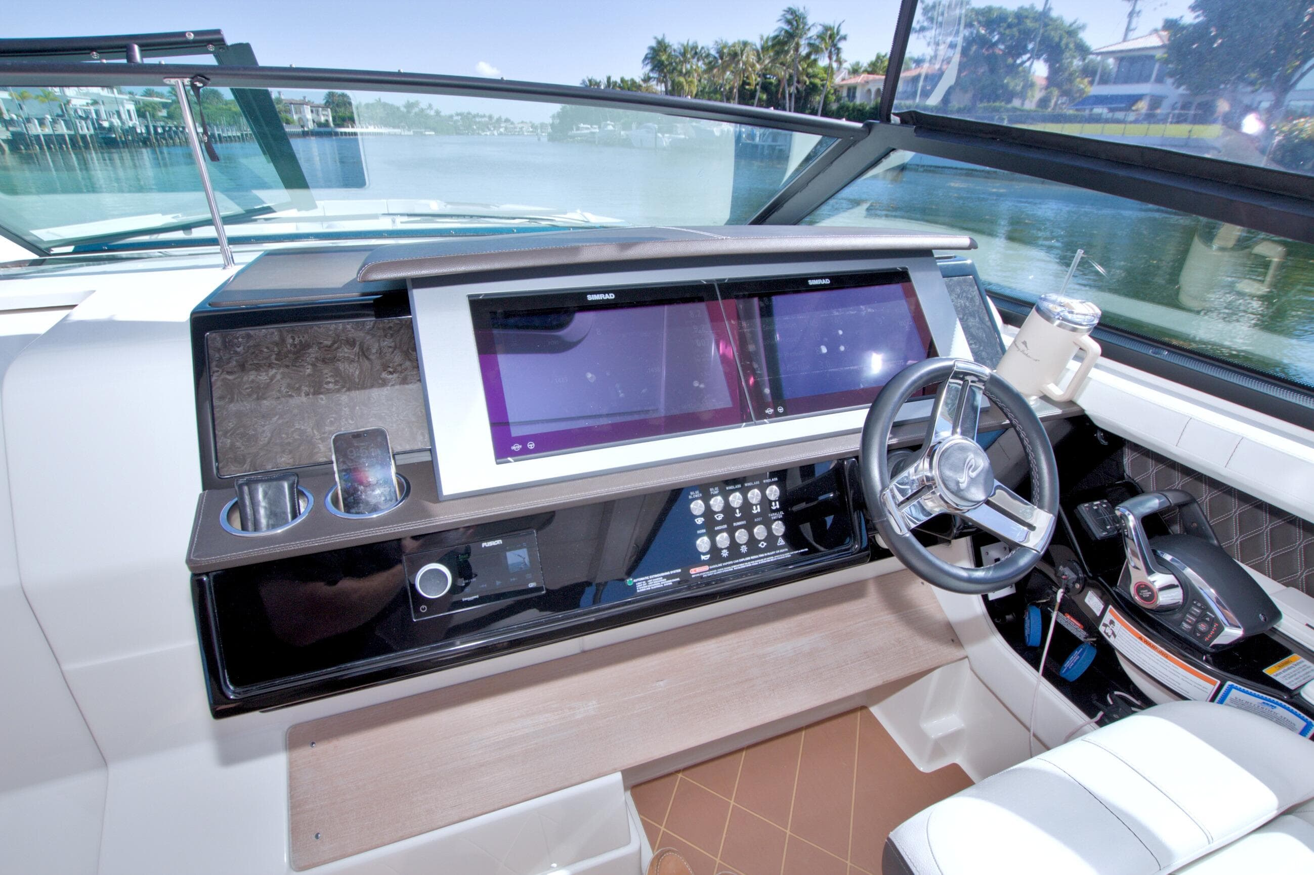 2021 Sea Ray SLX 400 Outboard helm with dual screens and modern controls.