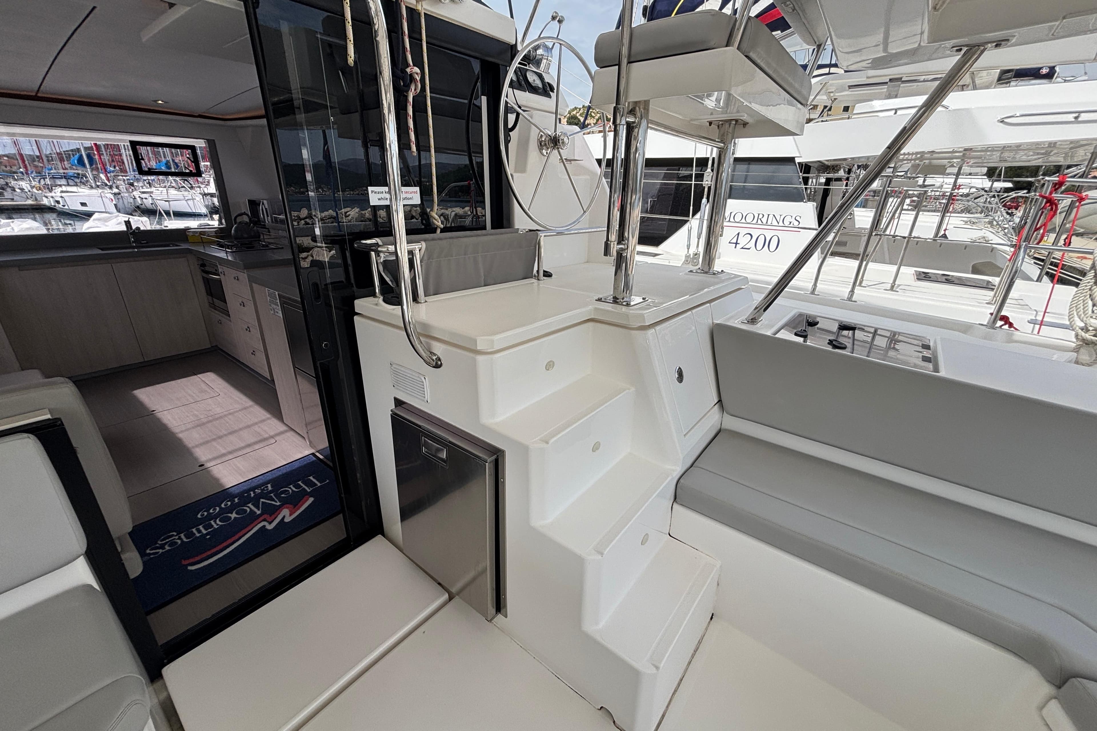 Interior view of a 2020 Leopard 45 yacht, showcasing modern kitchen and seating area.