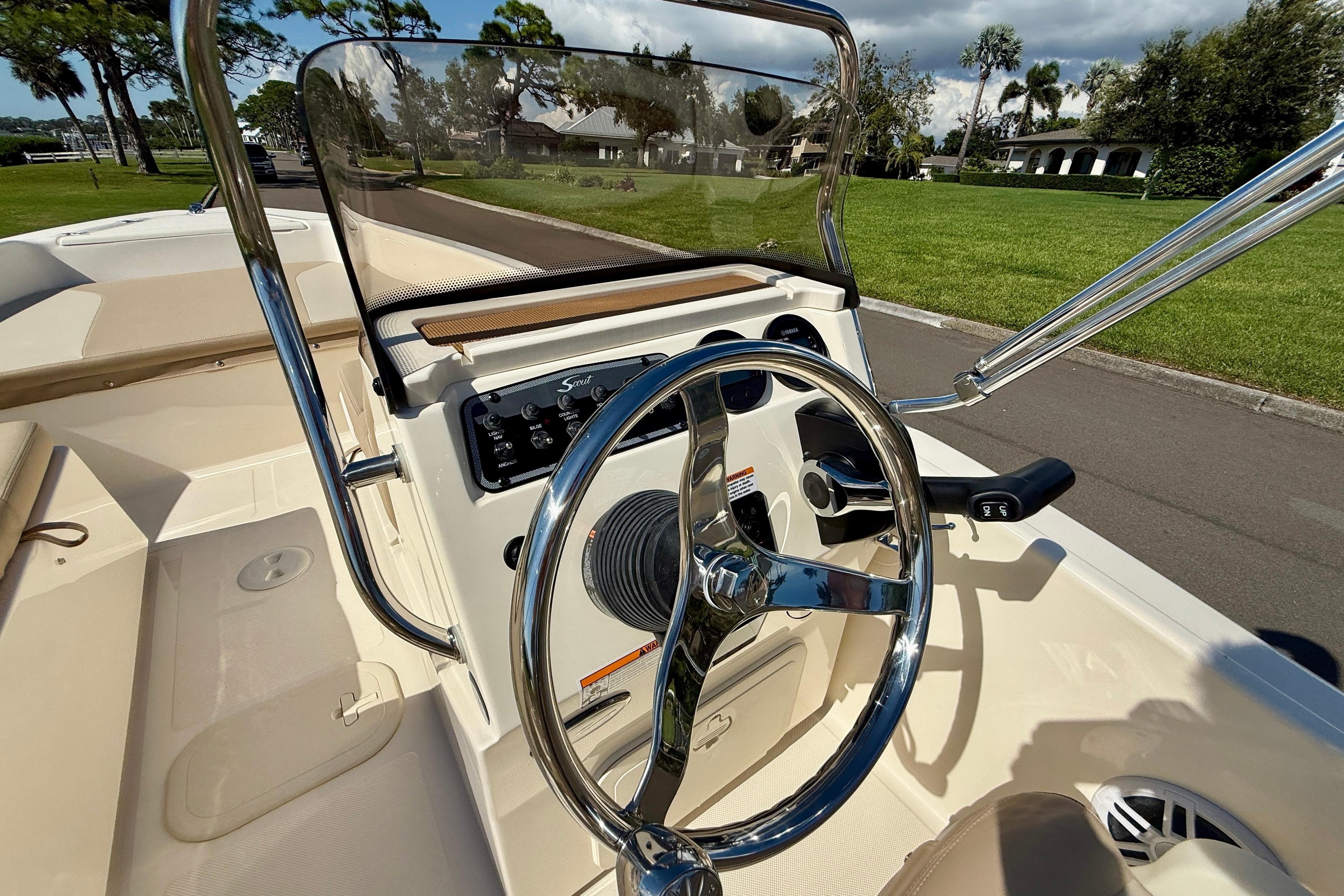 2026 Scout 175 Sport Dorado boat interior with steering wheel and control panel.