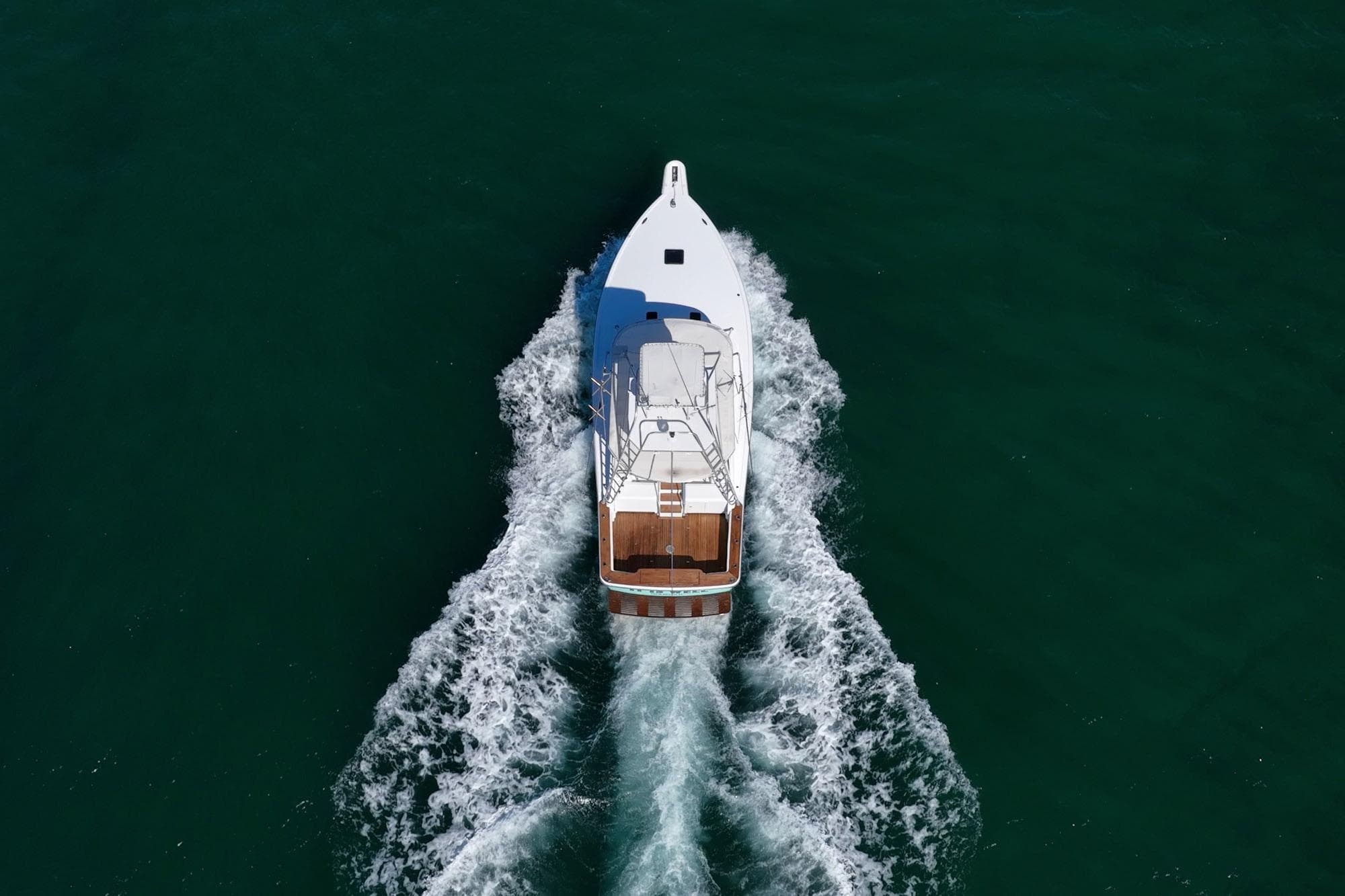 Aerial view of 1997 Strike 42 Express yacht cruising on open water.