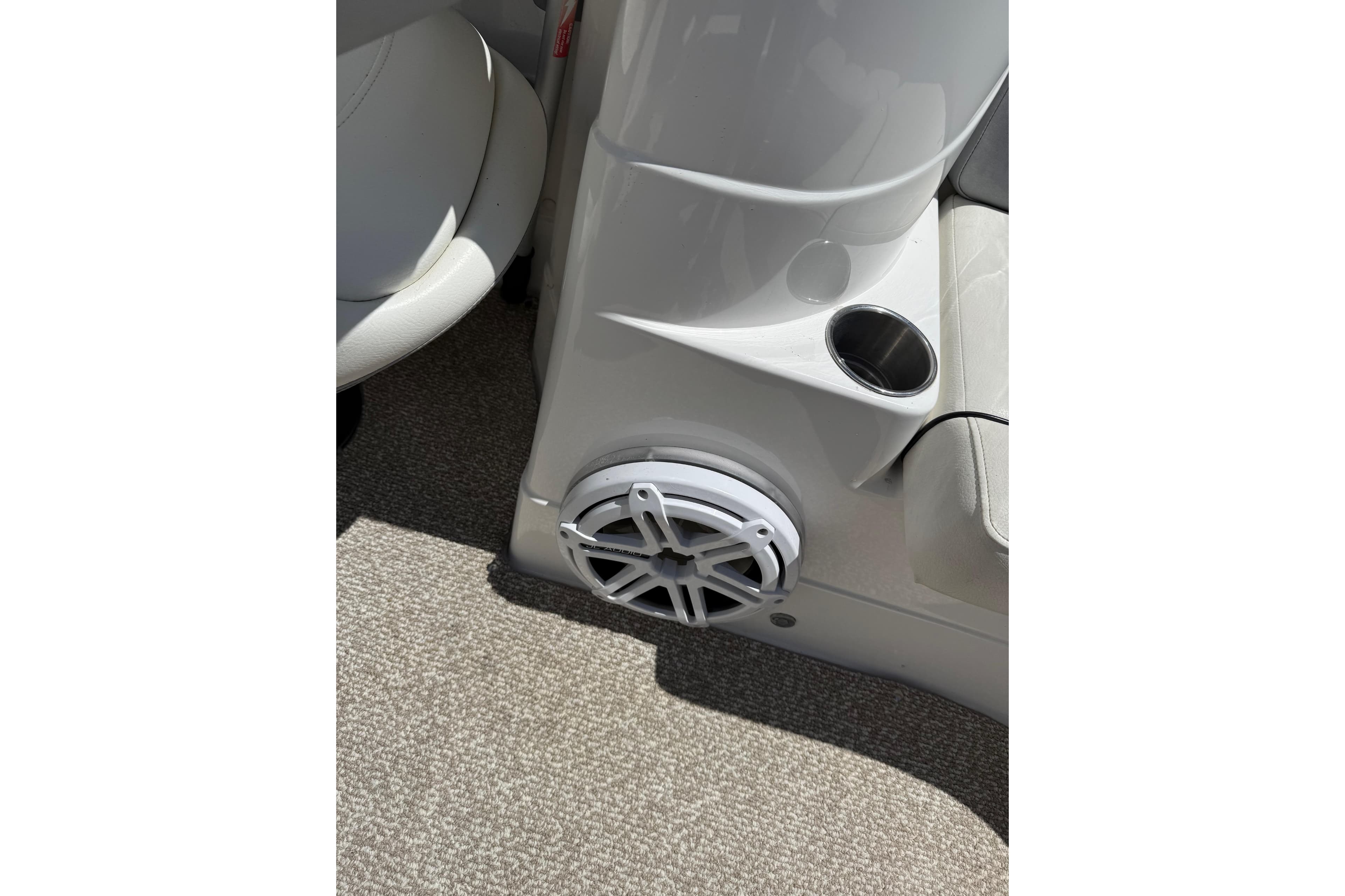2013 Rinker 246 Captiva Cuddy interior with speaker and cup holder.