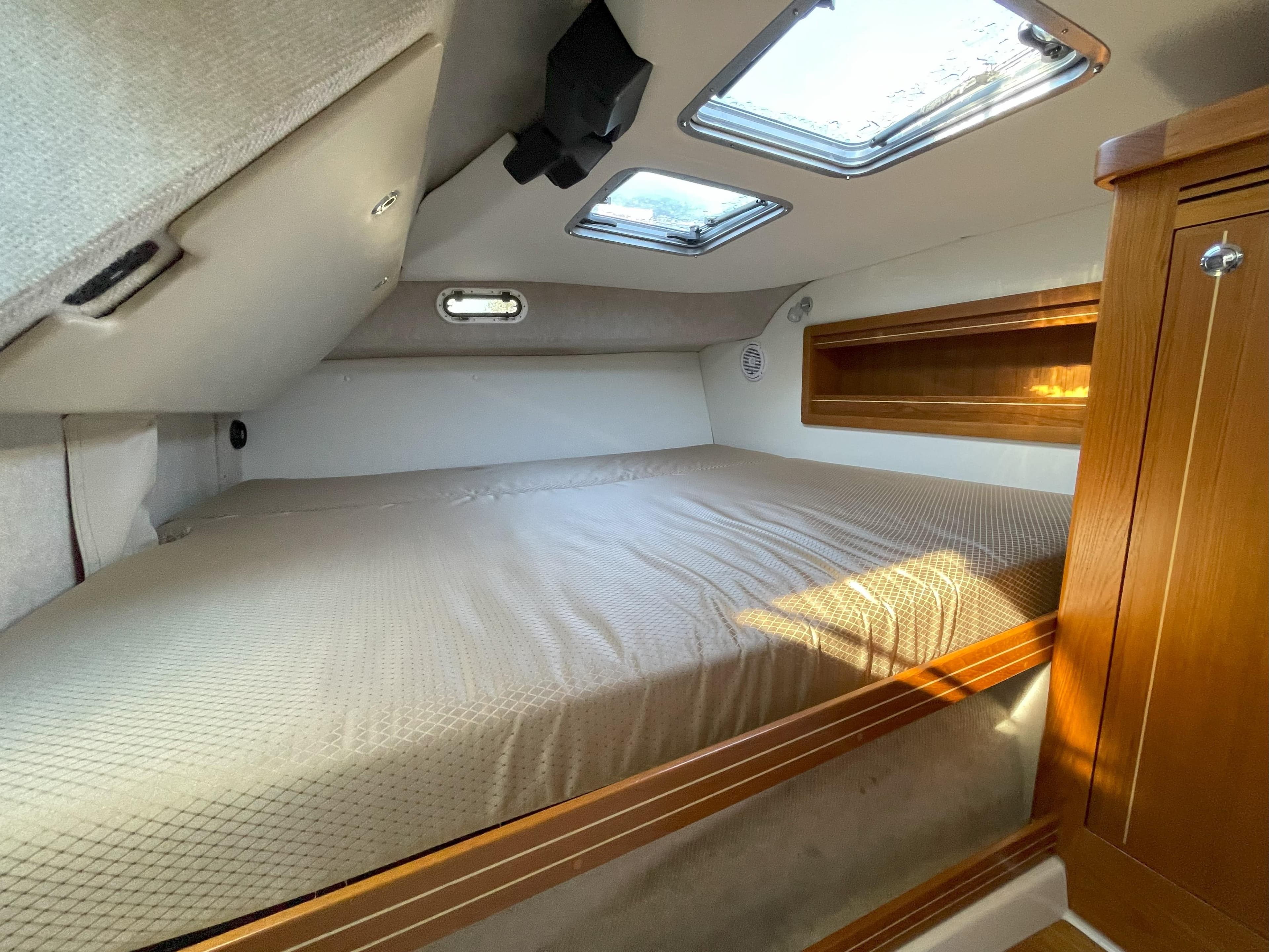 Interior of Aspen C100 yacht, cozy bedroom with skylights, 2018 model.