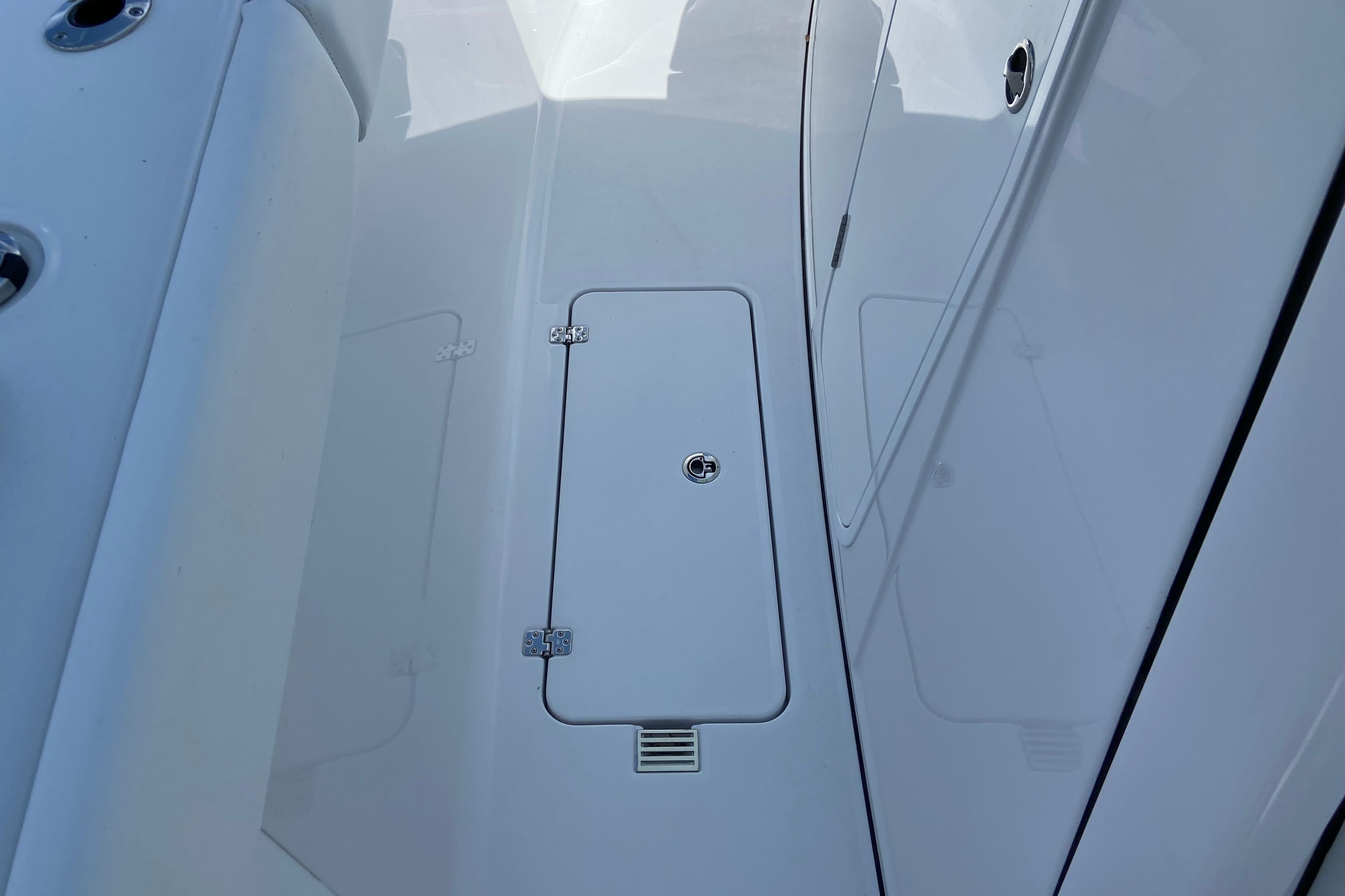 2026 Sportsman Heritage 321 Center Console deck with storage compartment.
