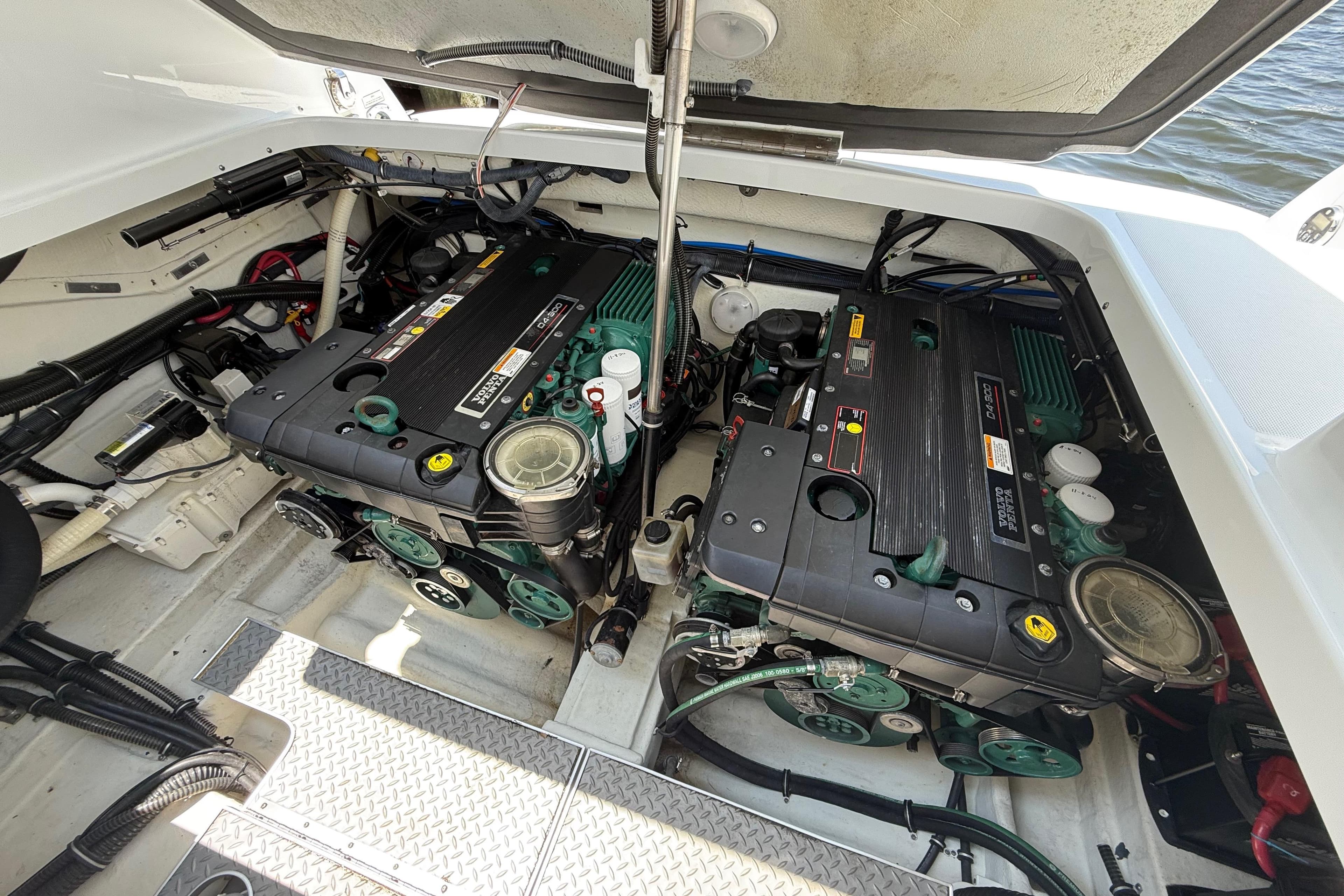 Engine compartment of a 2012 Formula 350 Sun Sport boat, showcasing dual engines.
