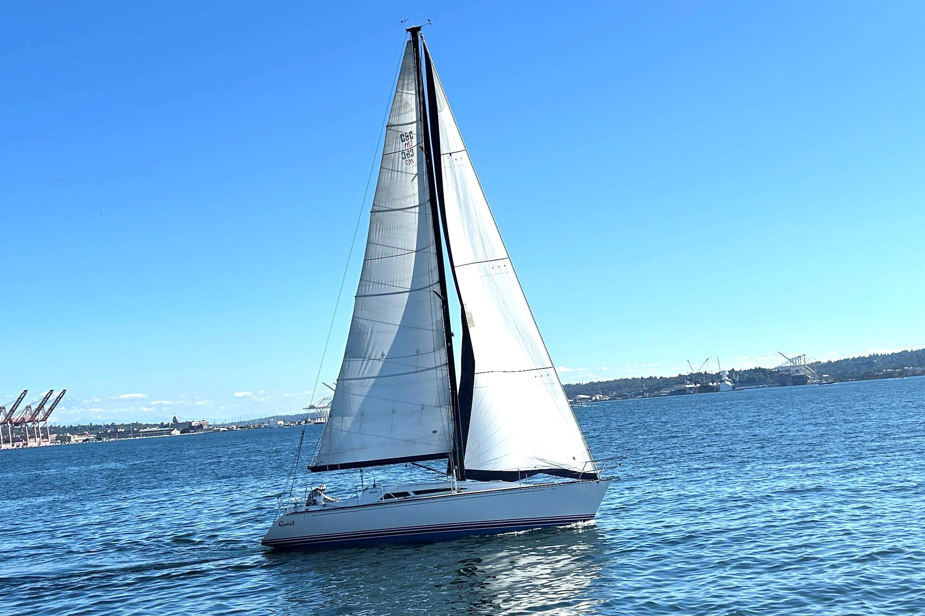 Sailboat C&C 110 (2004) gliding on blue water under clear sky.