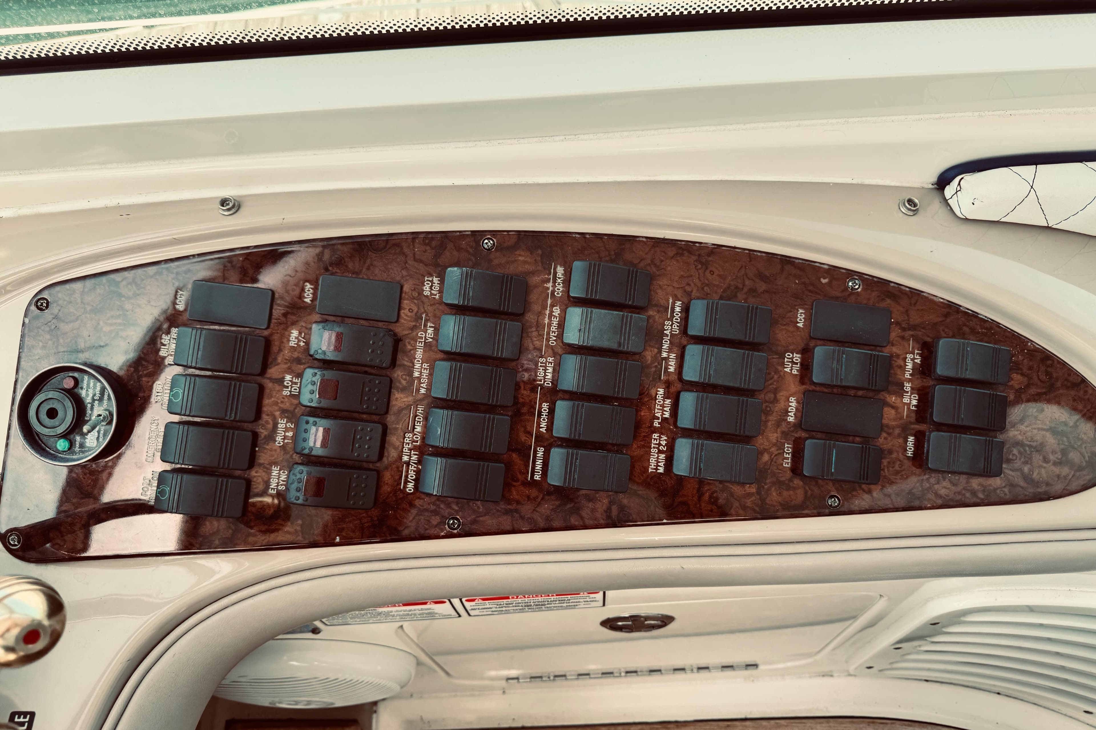 Control panel of a 2005 Sea Ray 500 Sundancer boat with multiple switches.