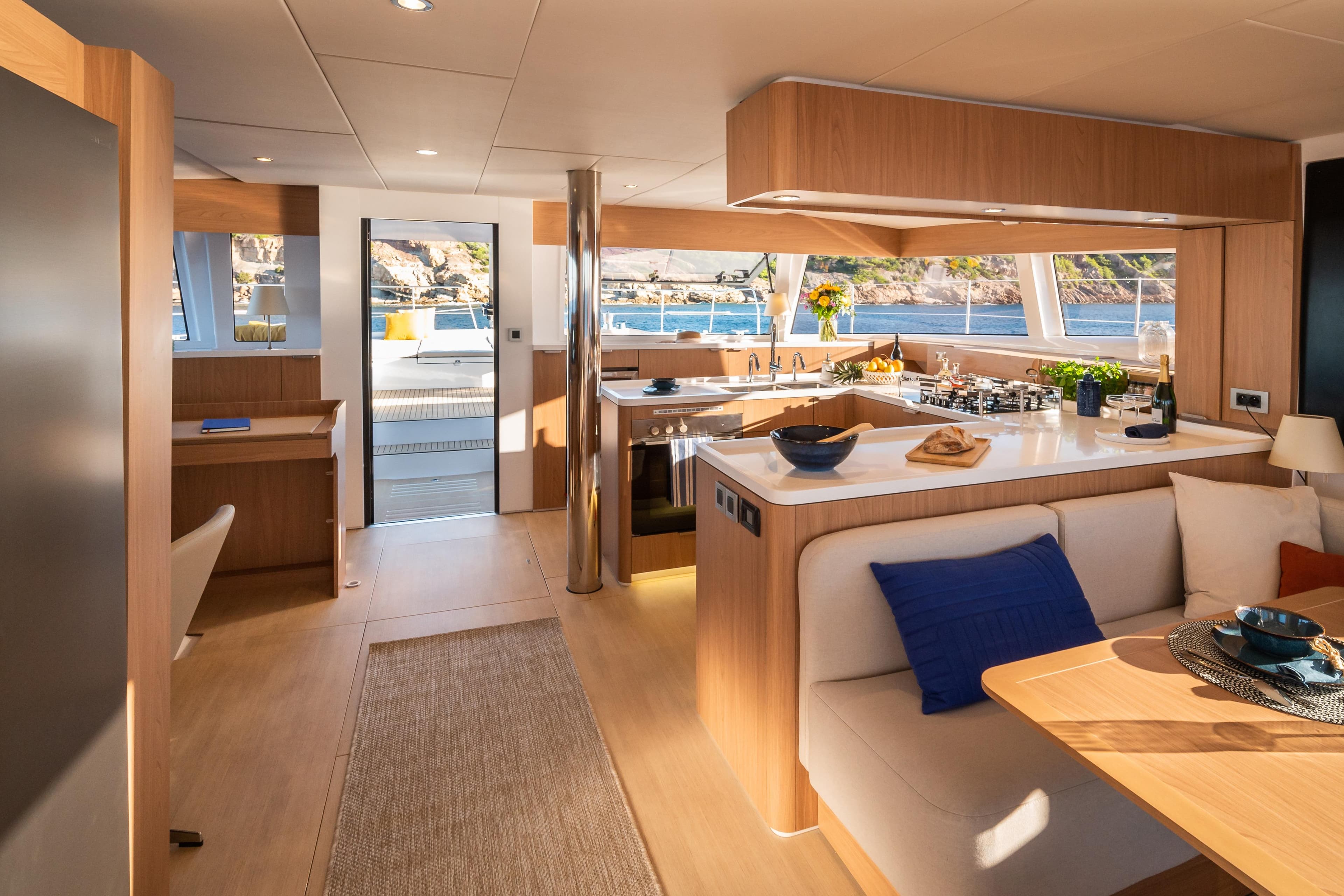 Luxurious interior of 2026 Bali 5.8 yacht with modern kitchen and seating area.