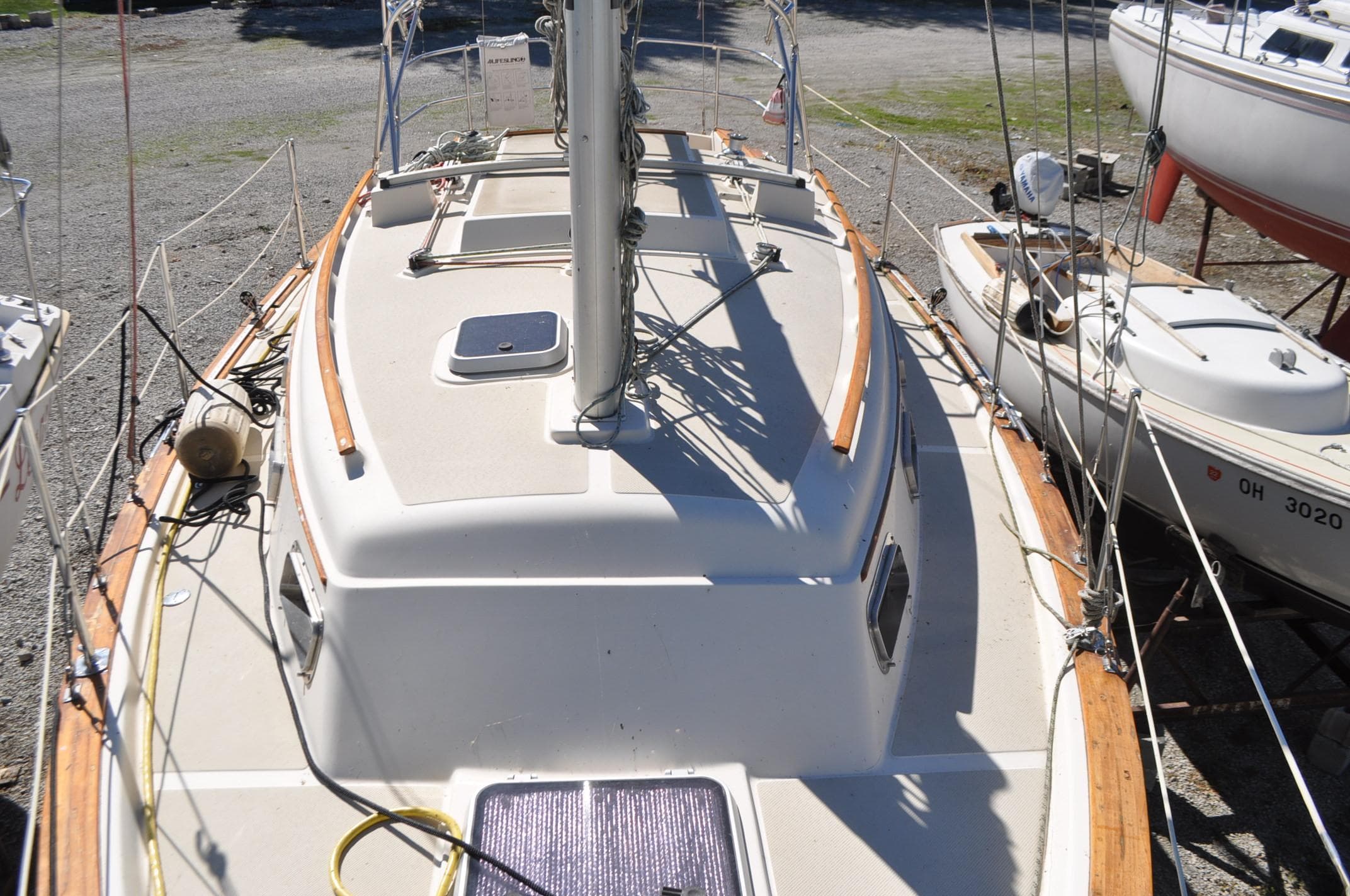 1989 Island Packet 27 sailboat on land, showcasing deck and mast.