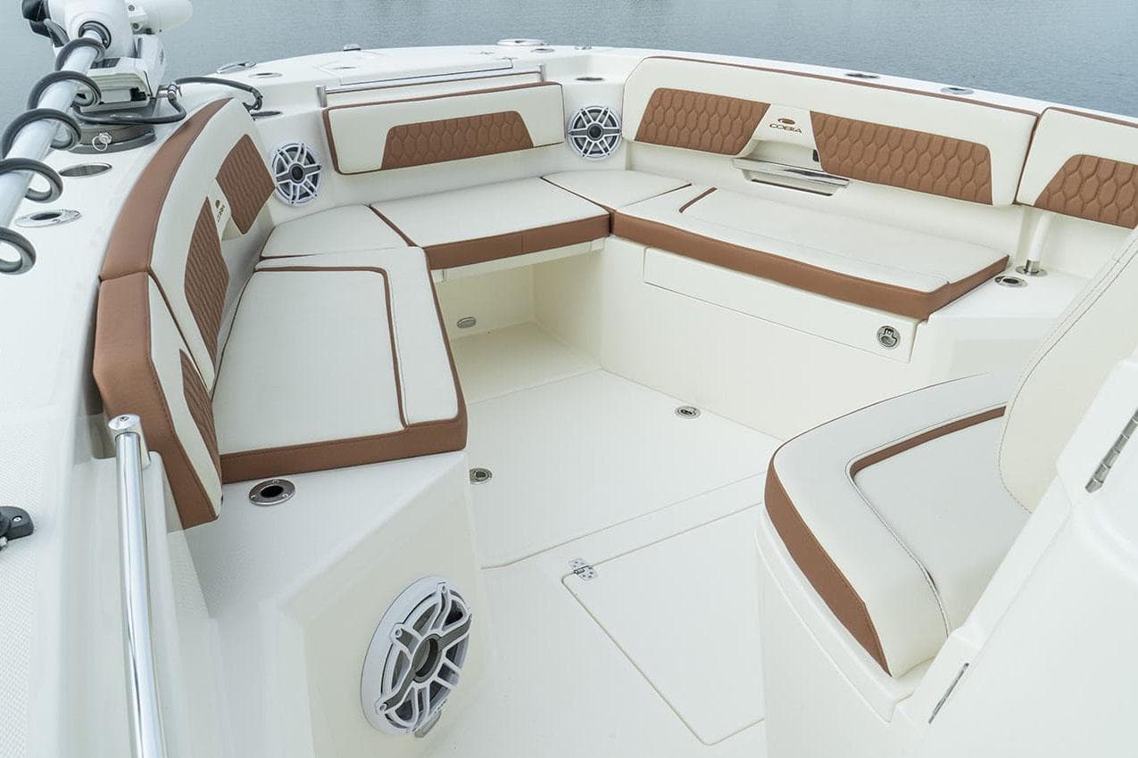 Manufacturer Provided Image: 2025 Cobia 285 Center Console boat interior with cushioned seating and speakers.
