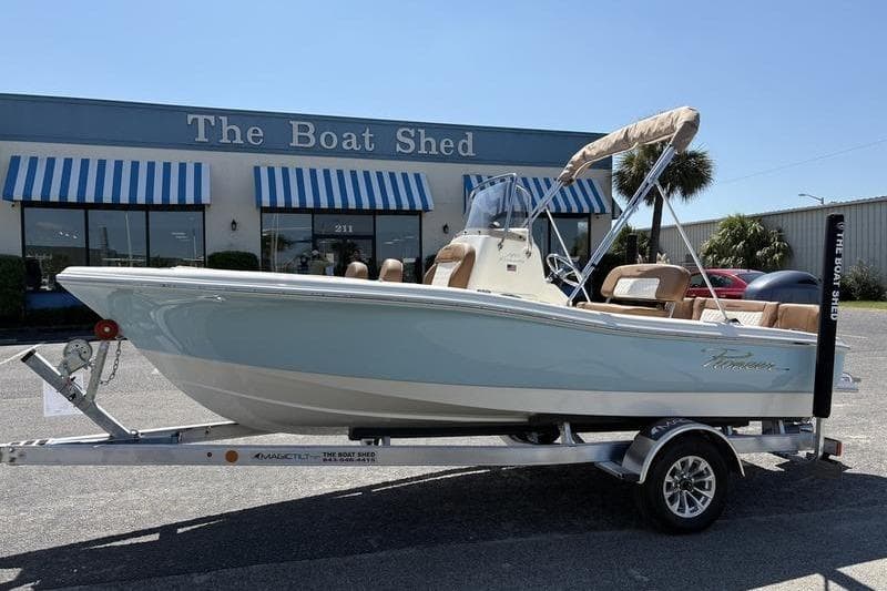 2026 Pioneer Islander 180 boat on trailer outside The Boat Shed dealership.