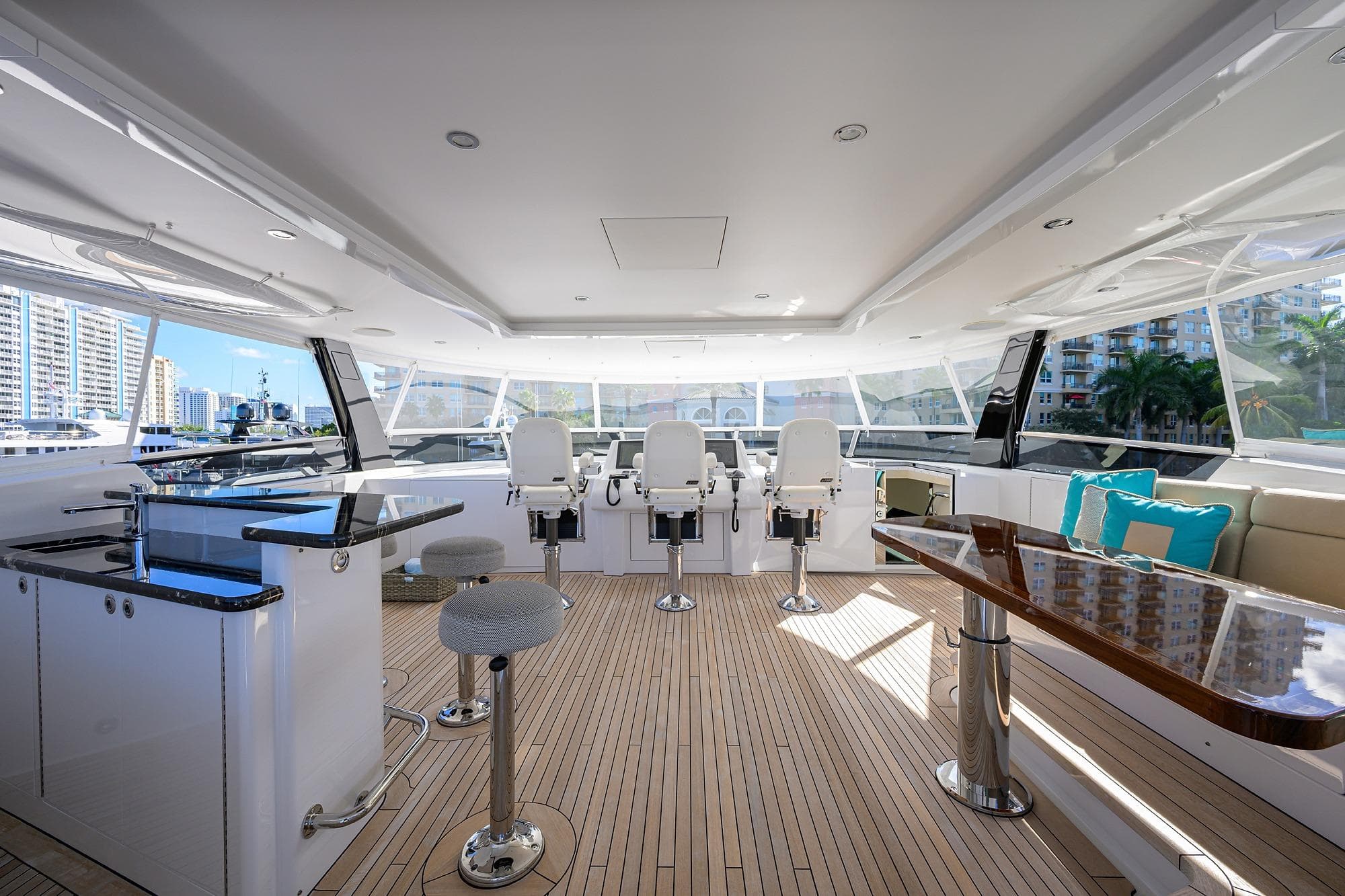 Luxurious 2019 Westport Raised Pilothouse M/Y interior with modern seating and panoramic windows.