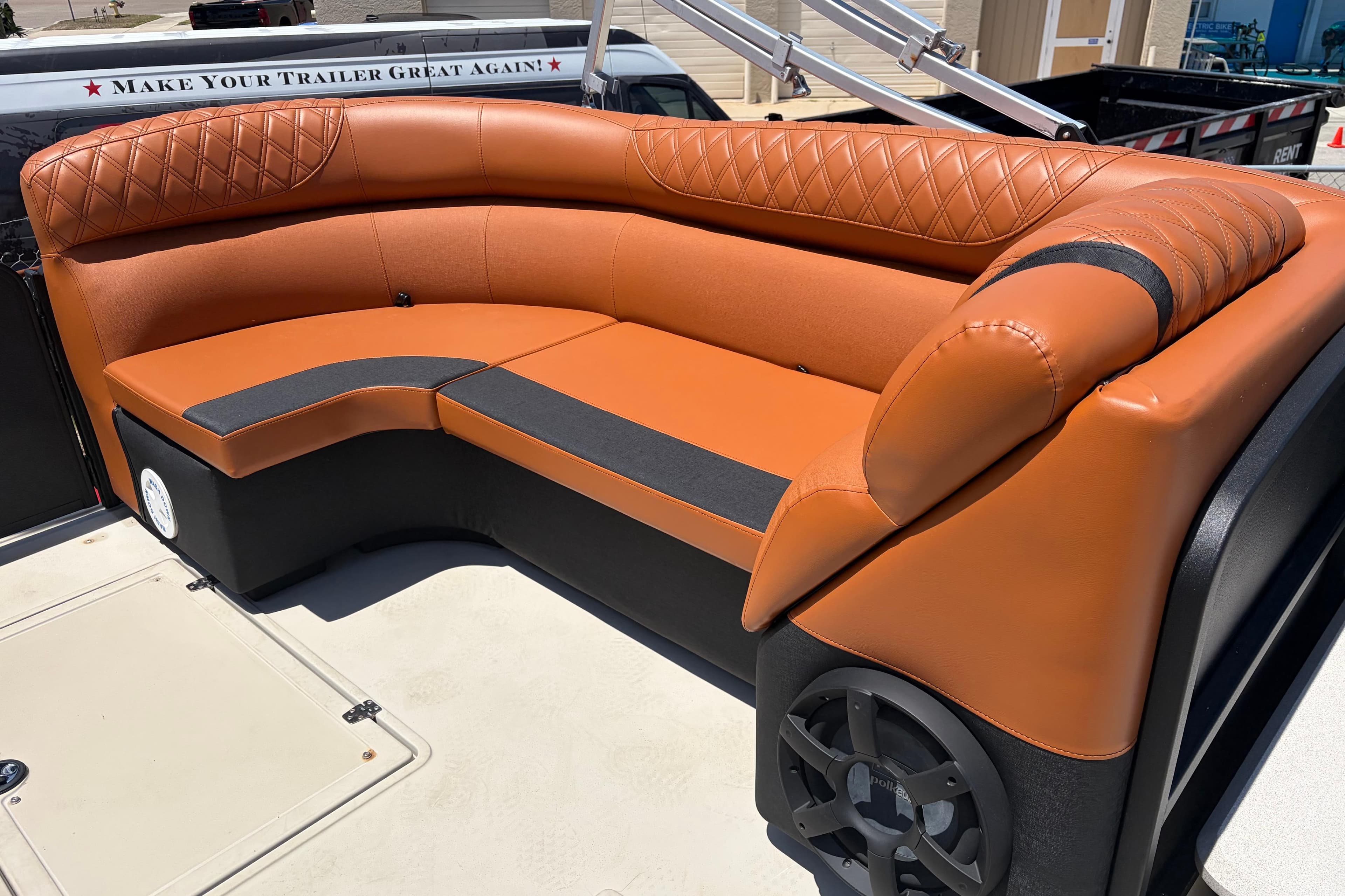 Luxurious seating on 2015 Premier 290 Grand View boat with stylish brown upholstery.