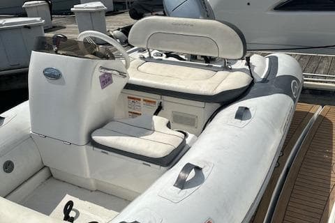 2019 Walker Bay Generation 11 LTE inflatable boat docked at marina.