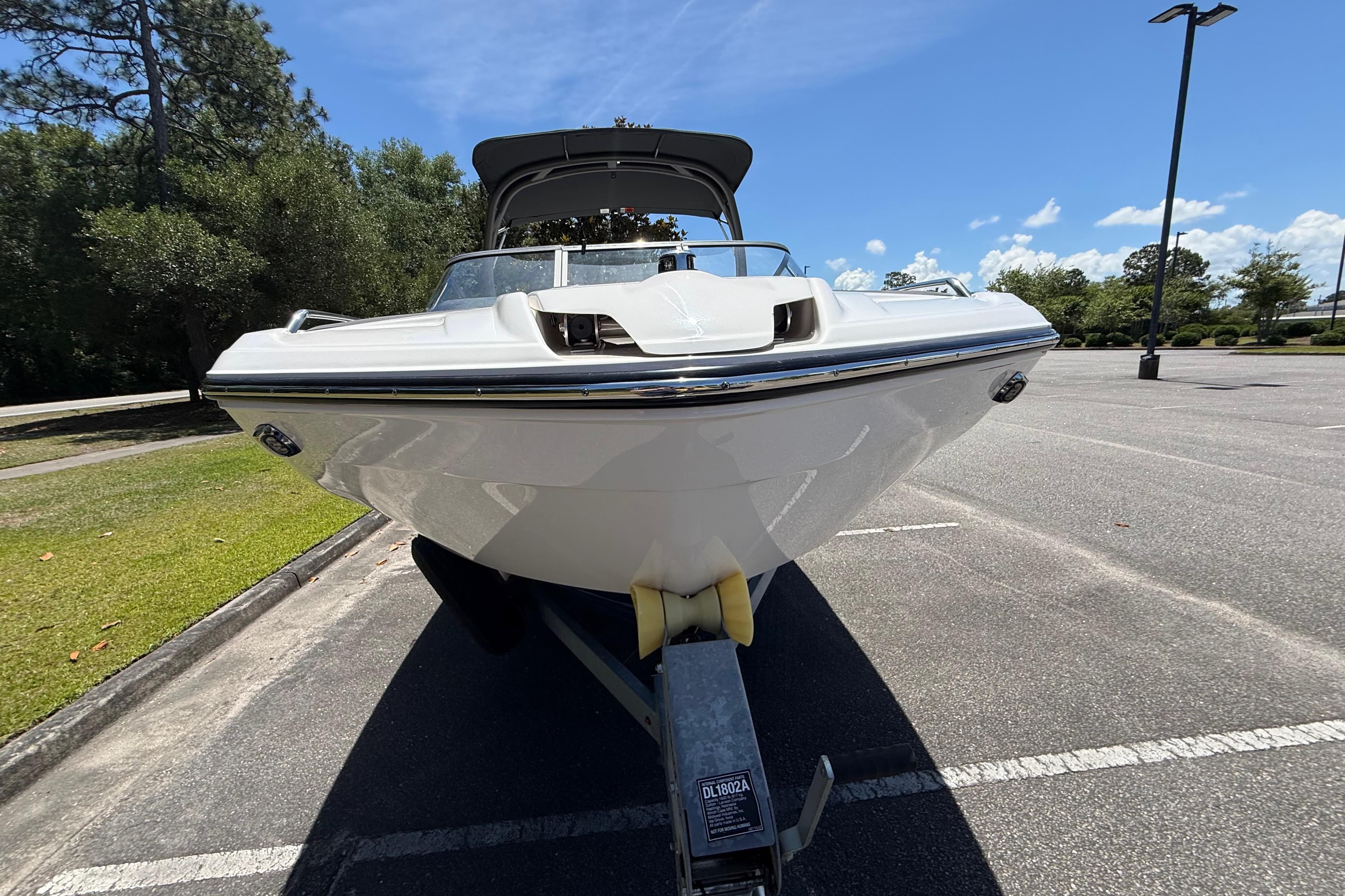 2020 Yamaha Boats 212S in a parking lot, showcasing sleek design and modern features.