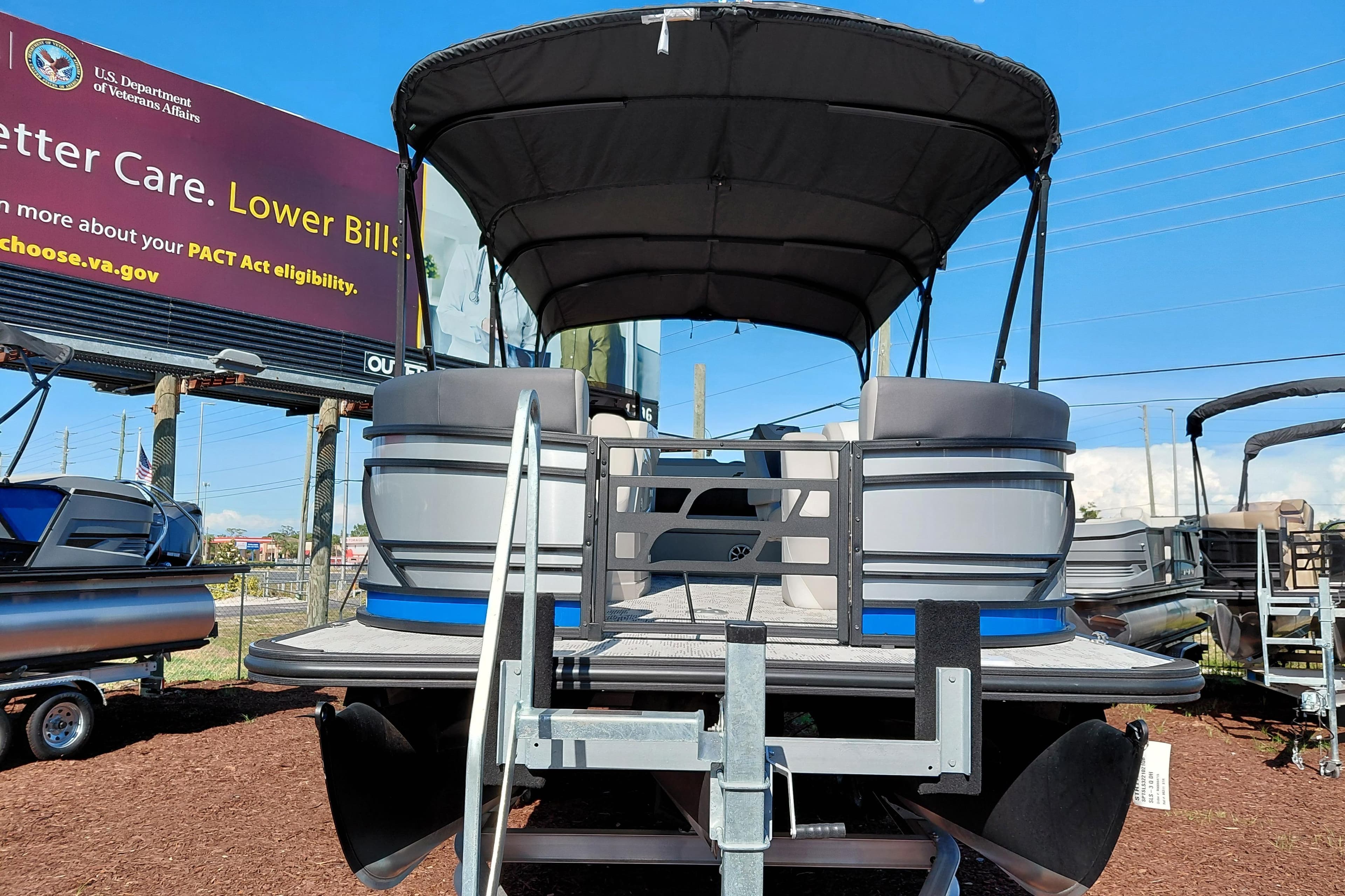 2026 Starcraft SLS 3 Q DH pontoon boat displayed outdoors on a trailer.