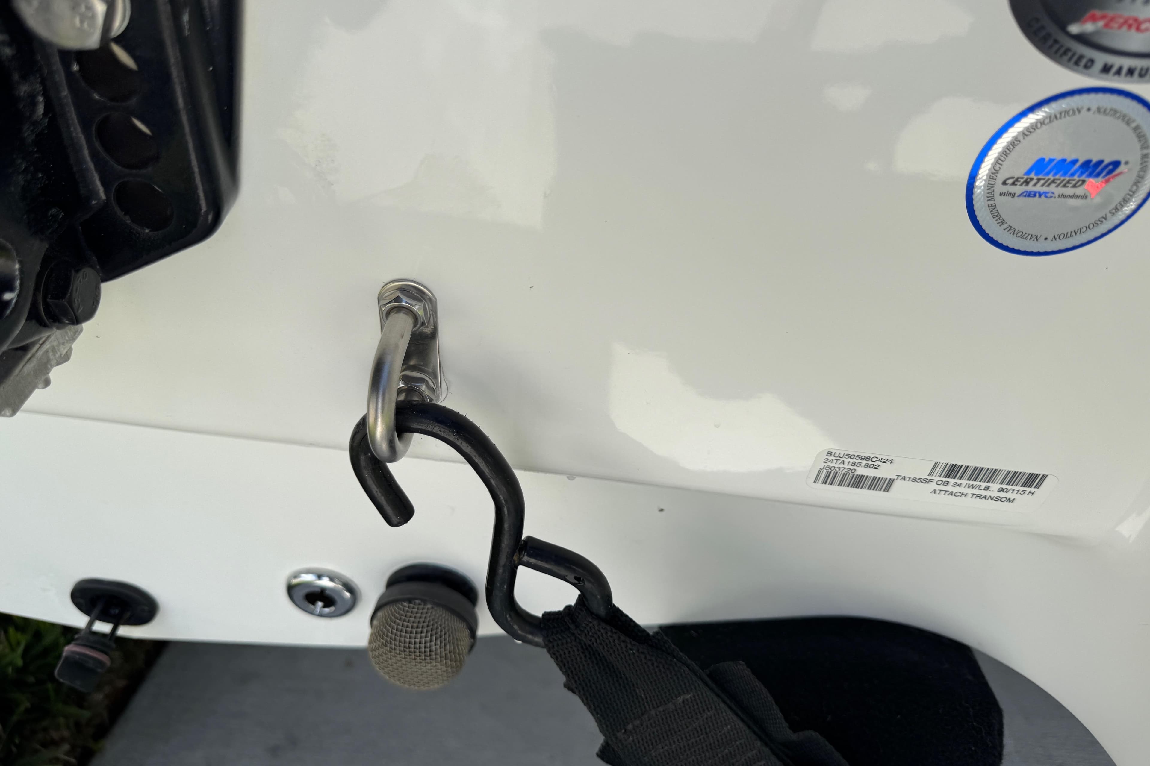 2024 Tahoe 185 S boat transom with hook and certification sticker.