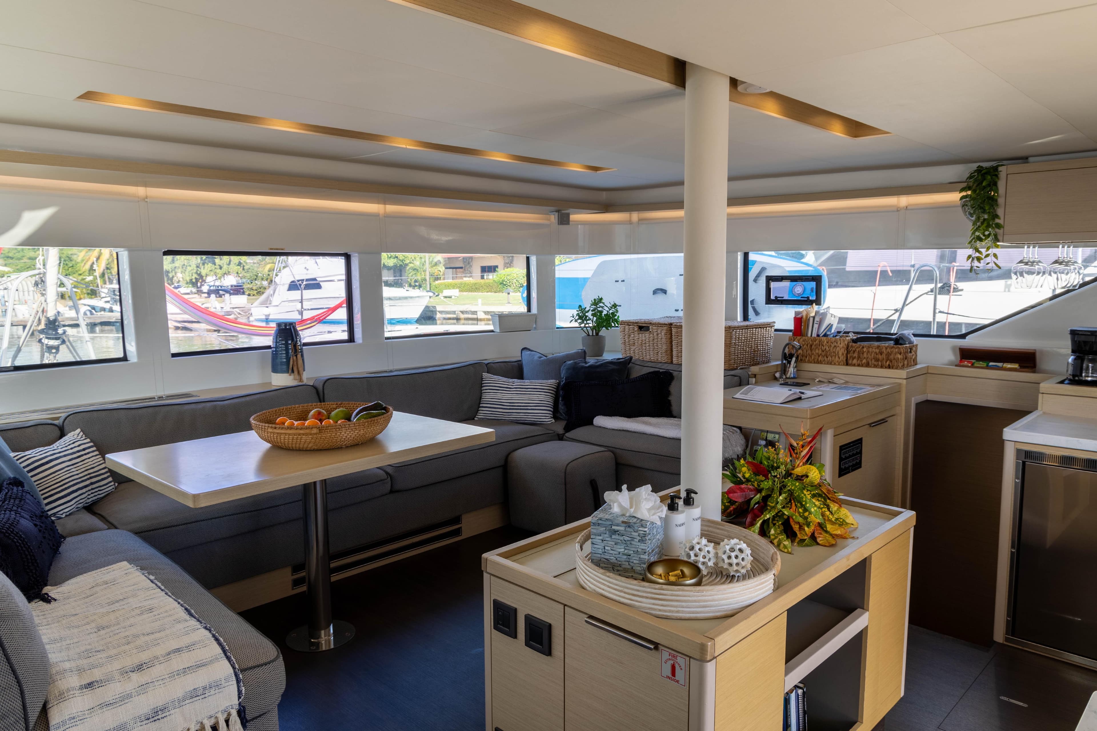 Luxurious interior of 2021 Lagoon 50 catamaran with modern furnishings and ample natural light.