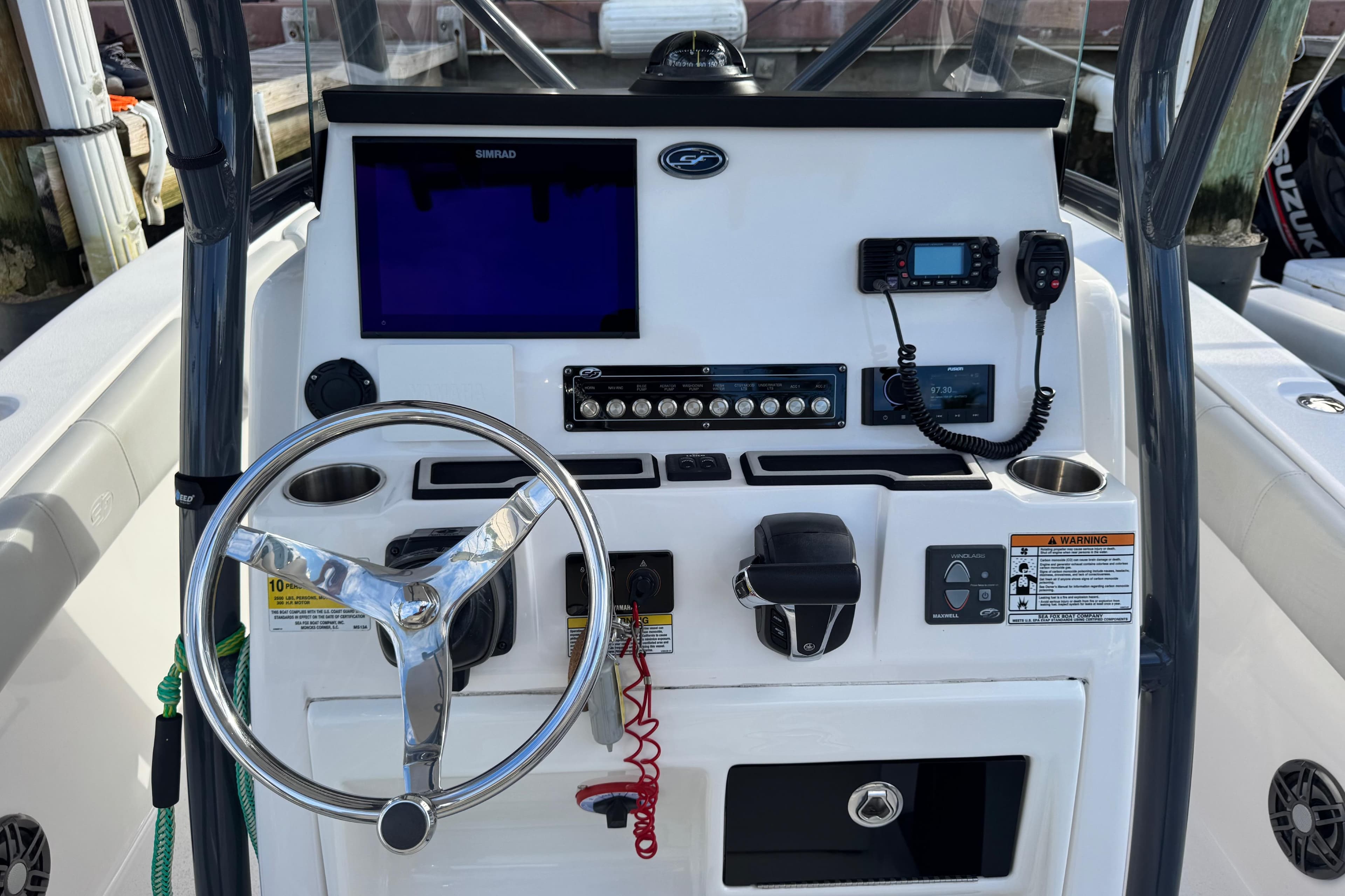 2022 Sea Fox 248 Commander boat dashboard with steering wheel and electronic controls.
