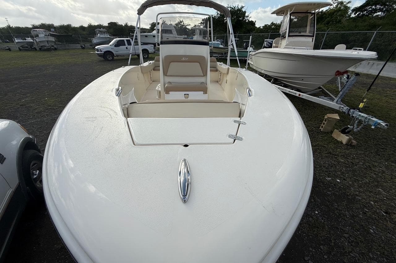2026 Scout 195 Sportfish boat on display in outdoor setting.
