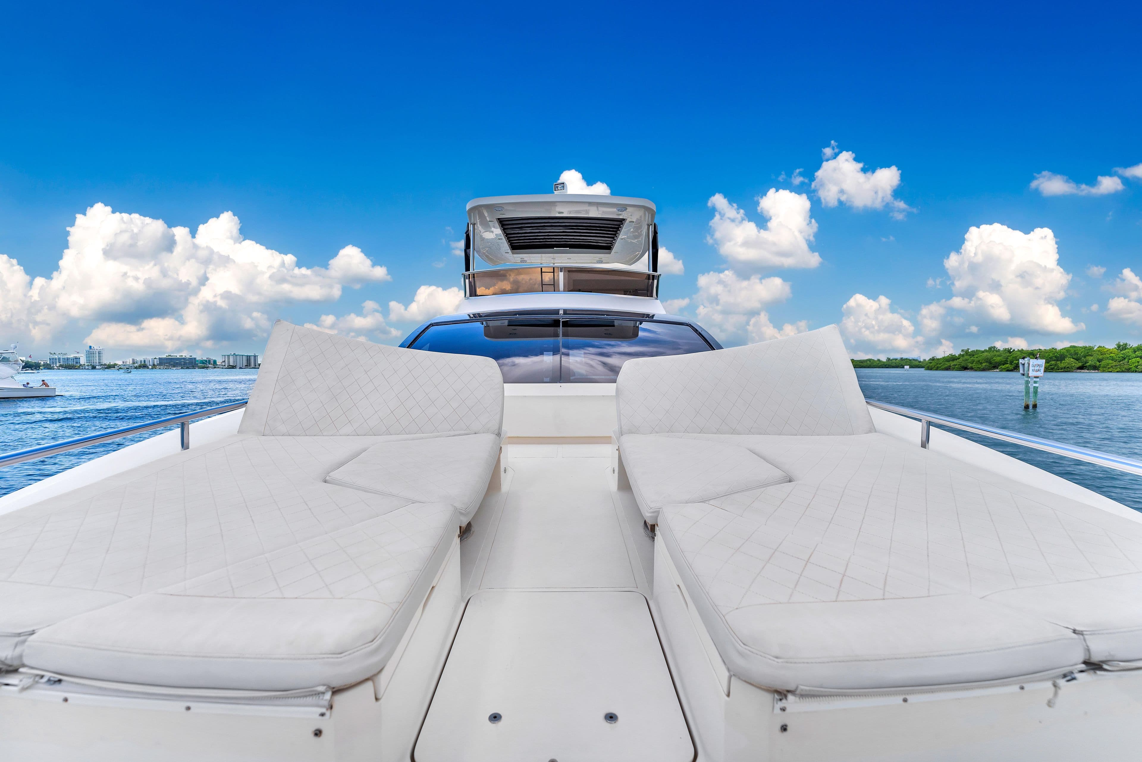 Luxurious 2013 Astondoa 72 GLX yacht with sun loungers on deck, under clear blue sky.