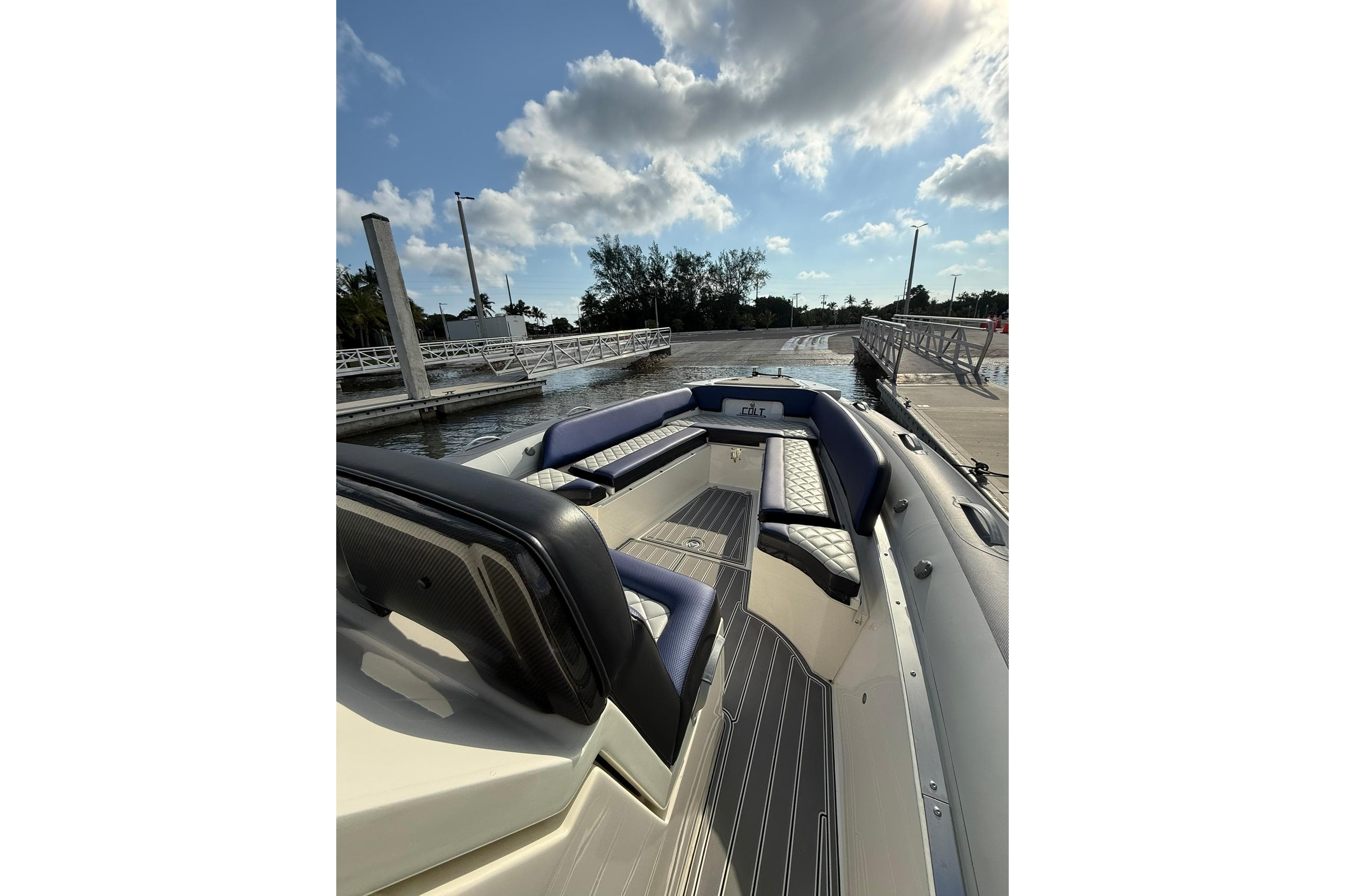 2018 RIB CVL Colt 35 boat docked, featuring sleek seating and modern design under a partly cloudy sky.