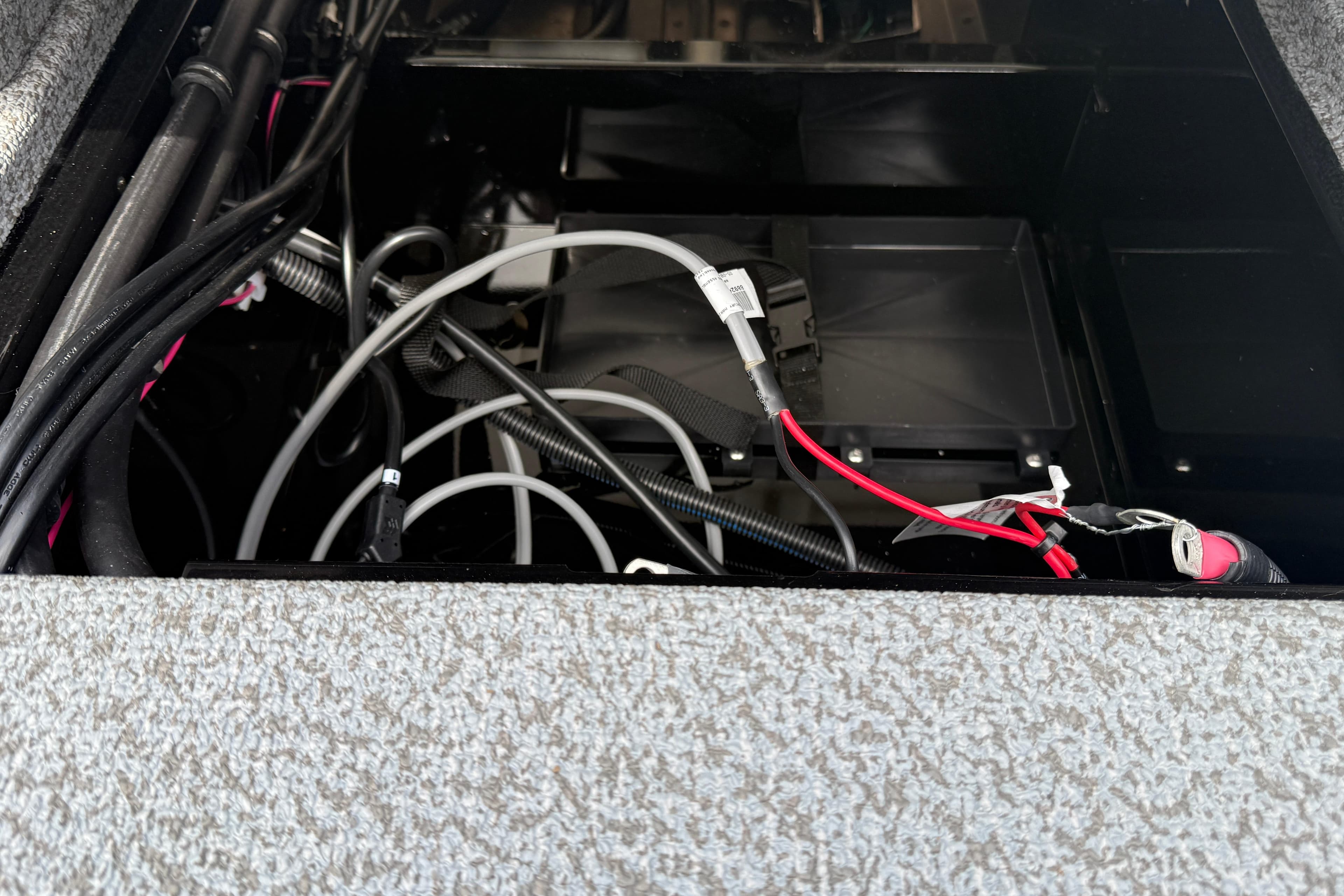 2026 Lund 2075 Impact XS boat wiring and battery compartment.