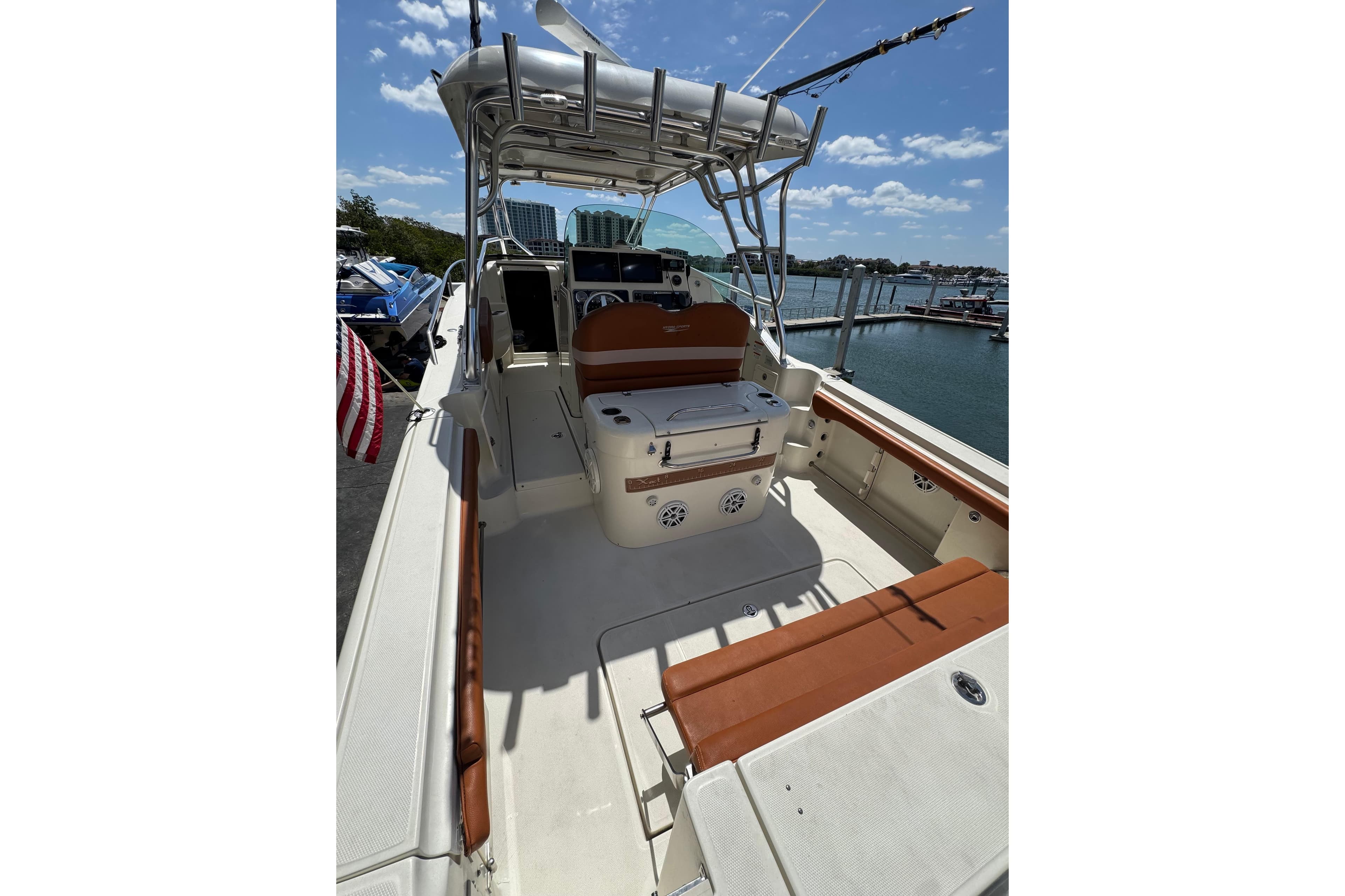 2006 Hydra-Sports Vector 3300 VX boat interior with seating and helm, docked by the water.