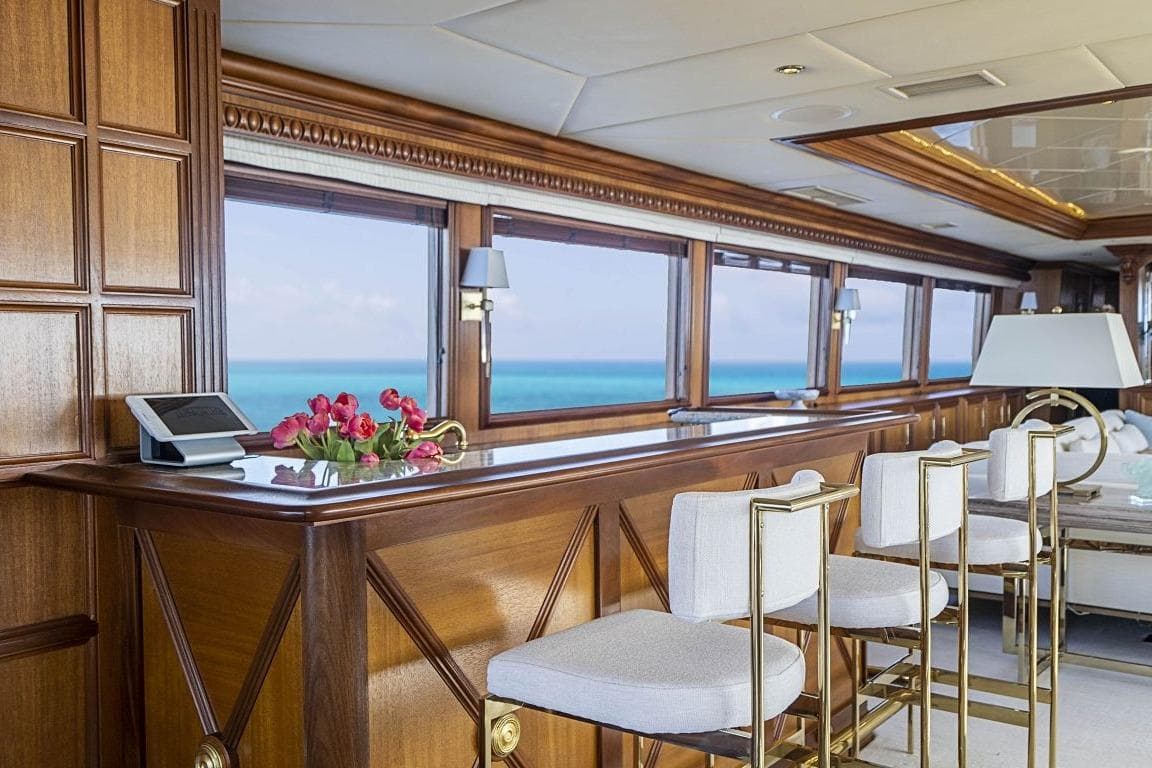 Luxurious Broward Raised Pilothouse yacht interior with elegant wood paneling and ocean view, 2000 model.