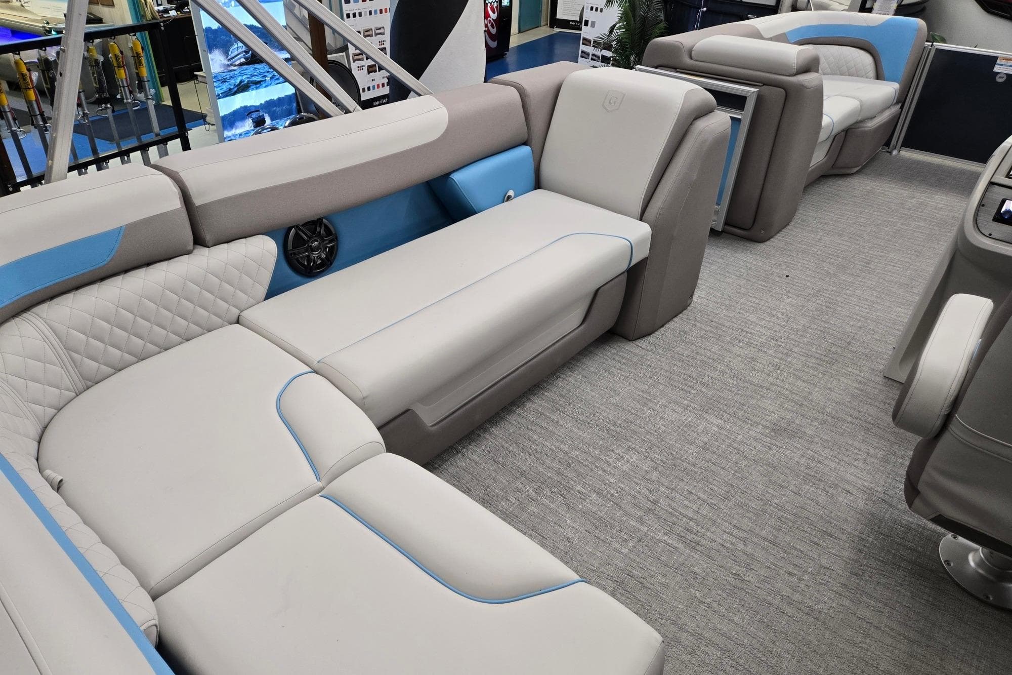 Luxurious interior of 2026 Godfrey Sweetwater 2086 C pontoon boat with plush seating.