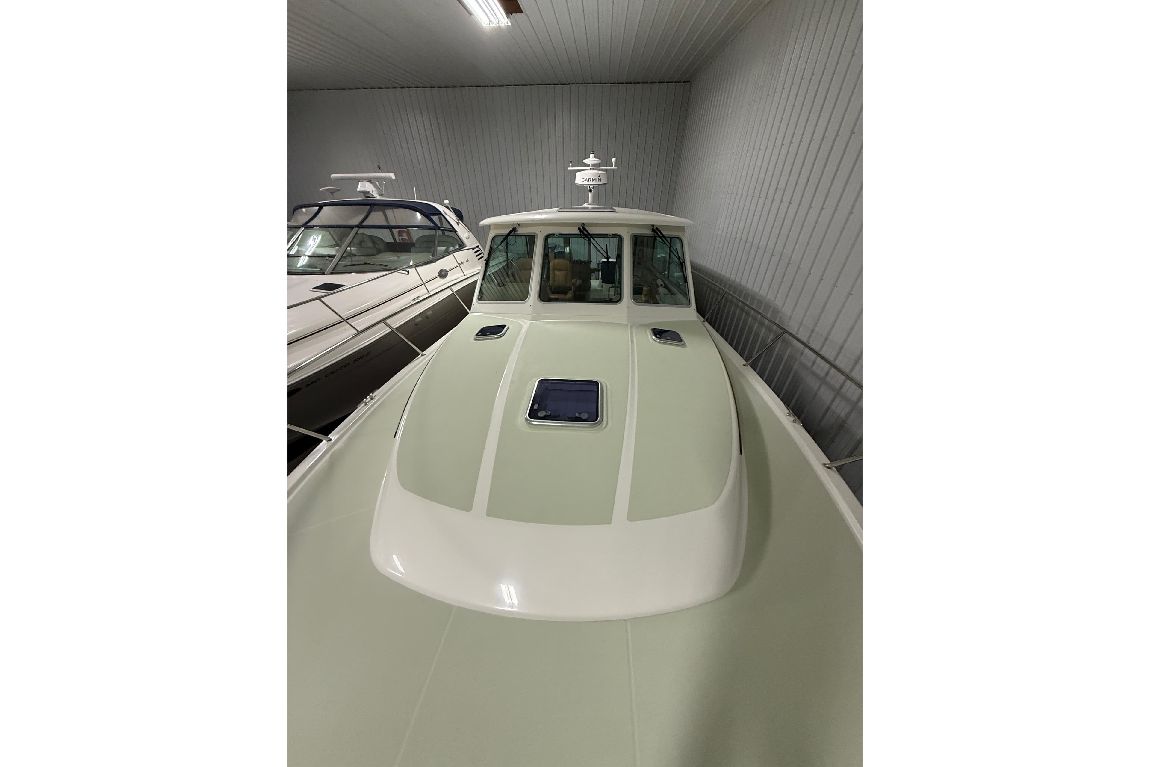 2017 Back Cove 37 boat in storage, showcasing sleek design and spacious deck.