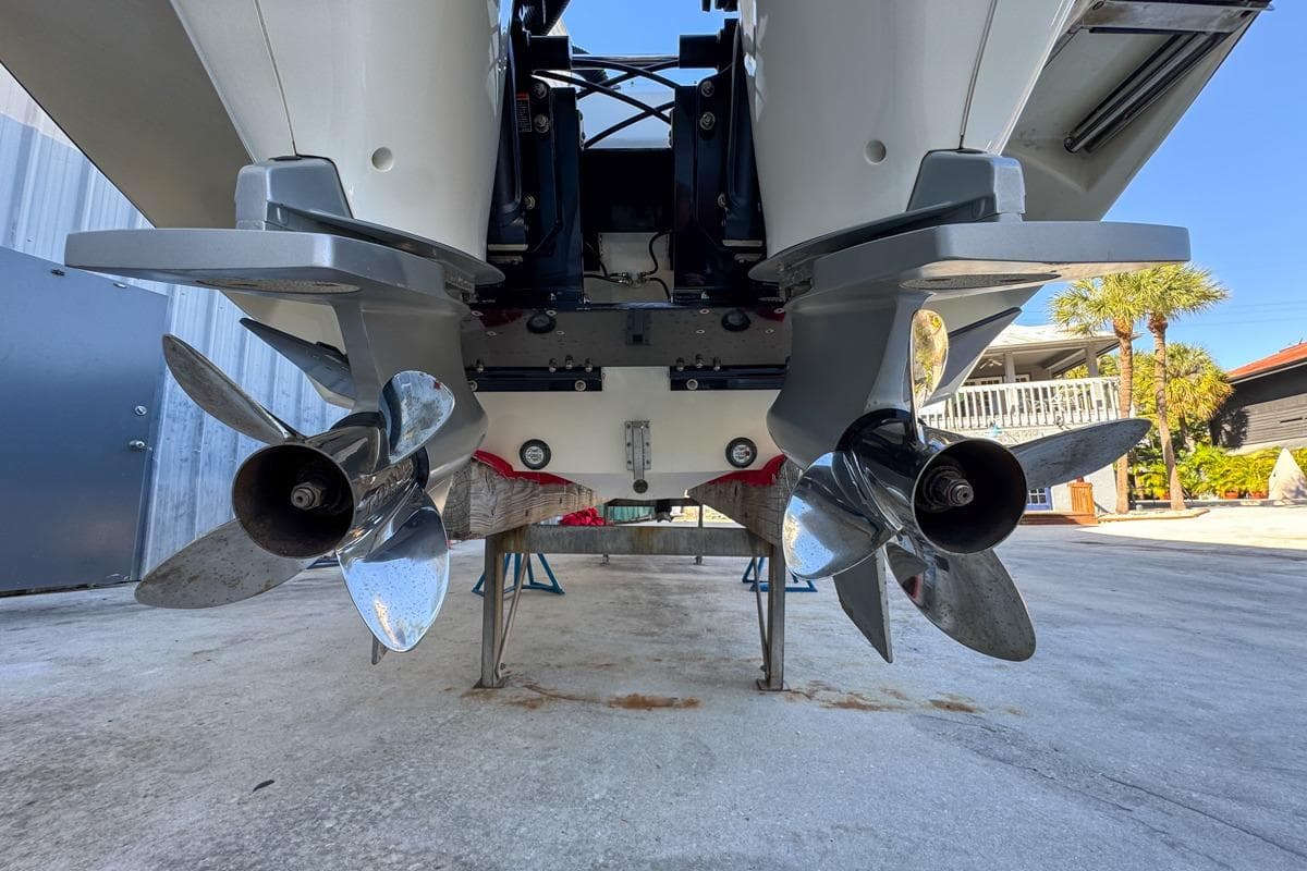 2022 Velocity 290sc boat propellers, close-up view, showcasing dual outboard motors.