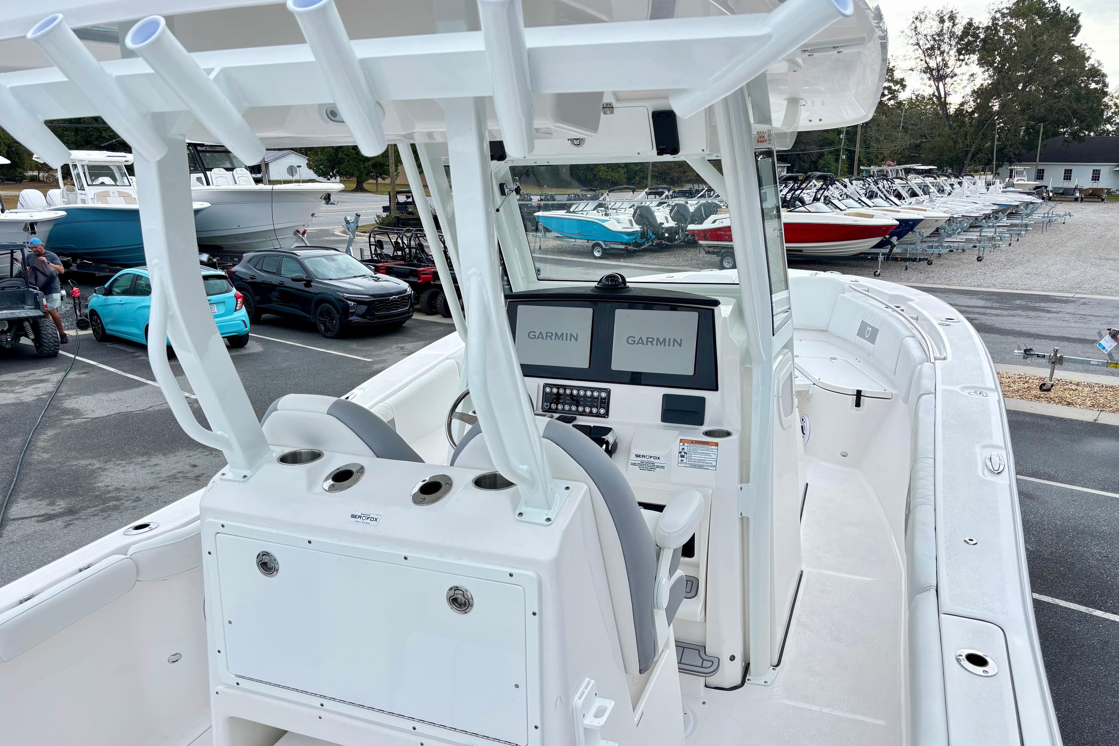 2026 Sea Fox 288 Commander boat with Garmin navigation, parked in a marina lot.