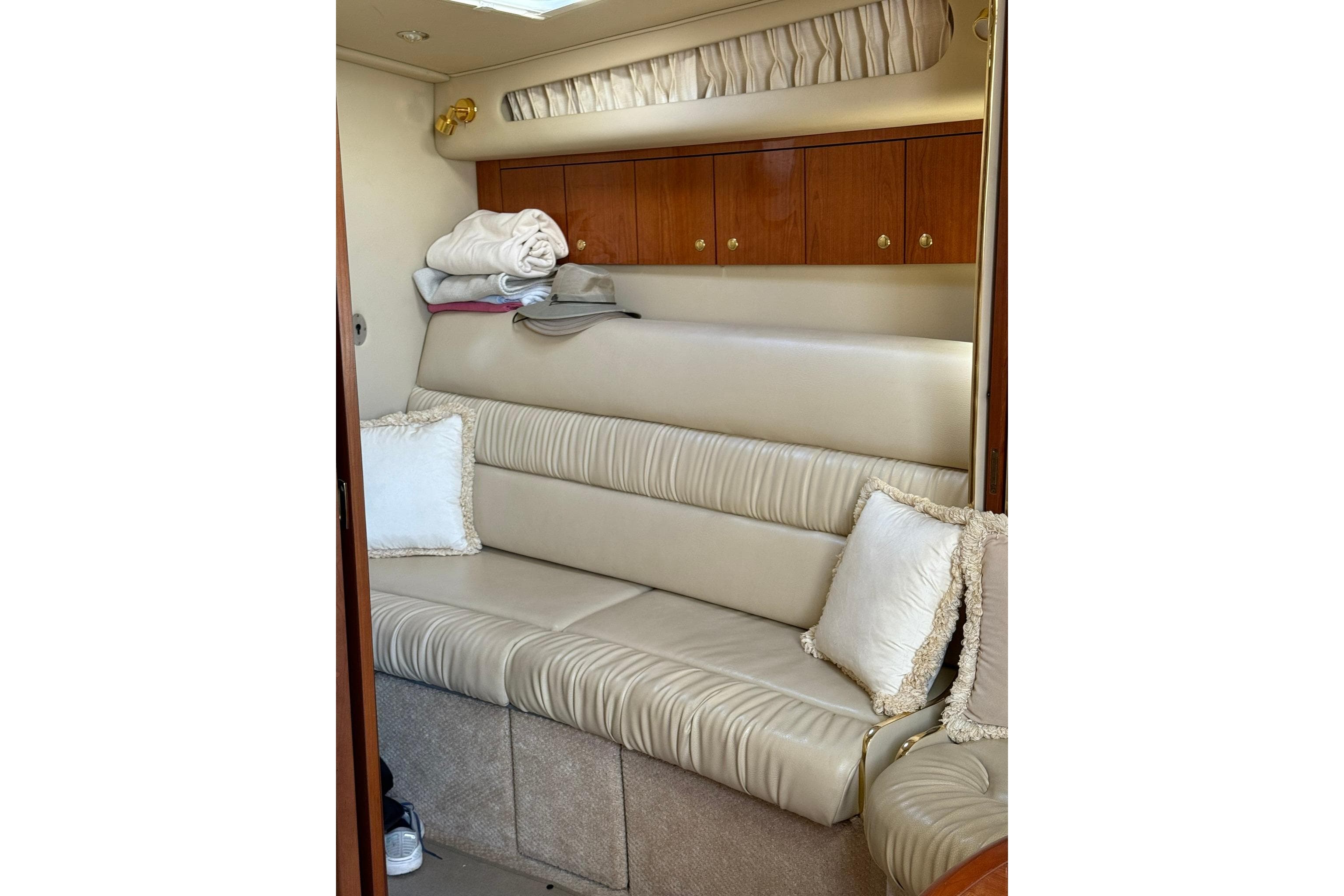 Luxurious interior of 2000 Sea Ray 410 Express Cruiser with plush seating and elegant decor.