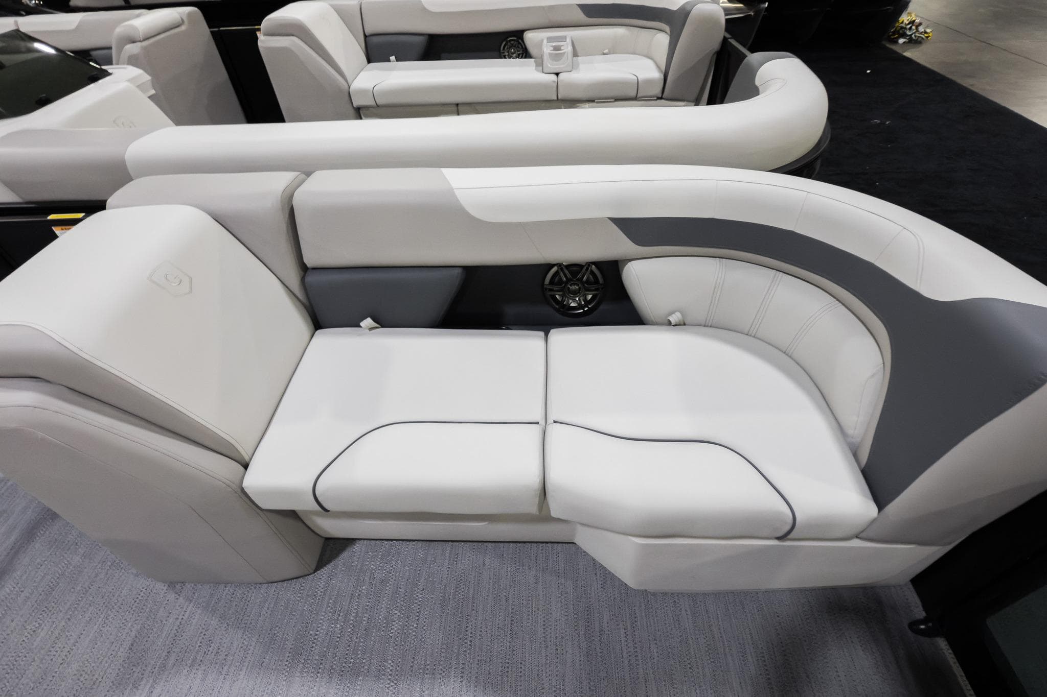 Luxurious seating on 2026 Godfrey Sweetwater 22' Tritoon, featuring elegant design and comfort.