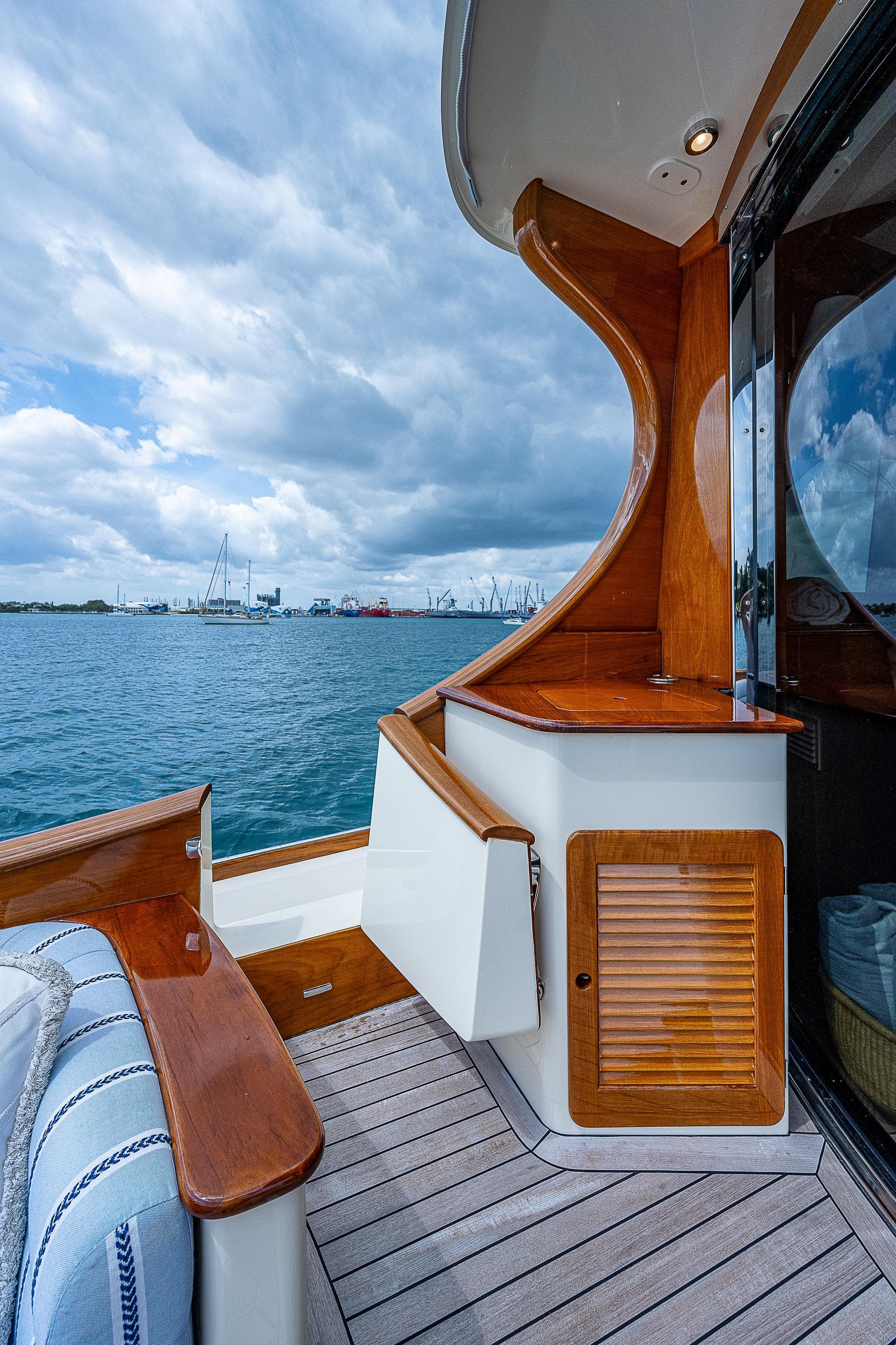 2018 Hinckley Talaria 55 MKII MY yacht deck with ocean view and elegant wood finish.