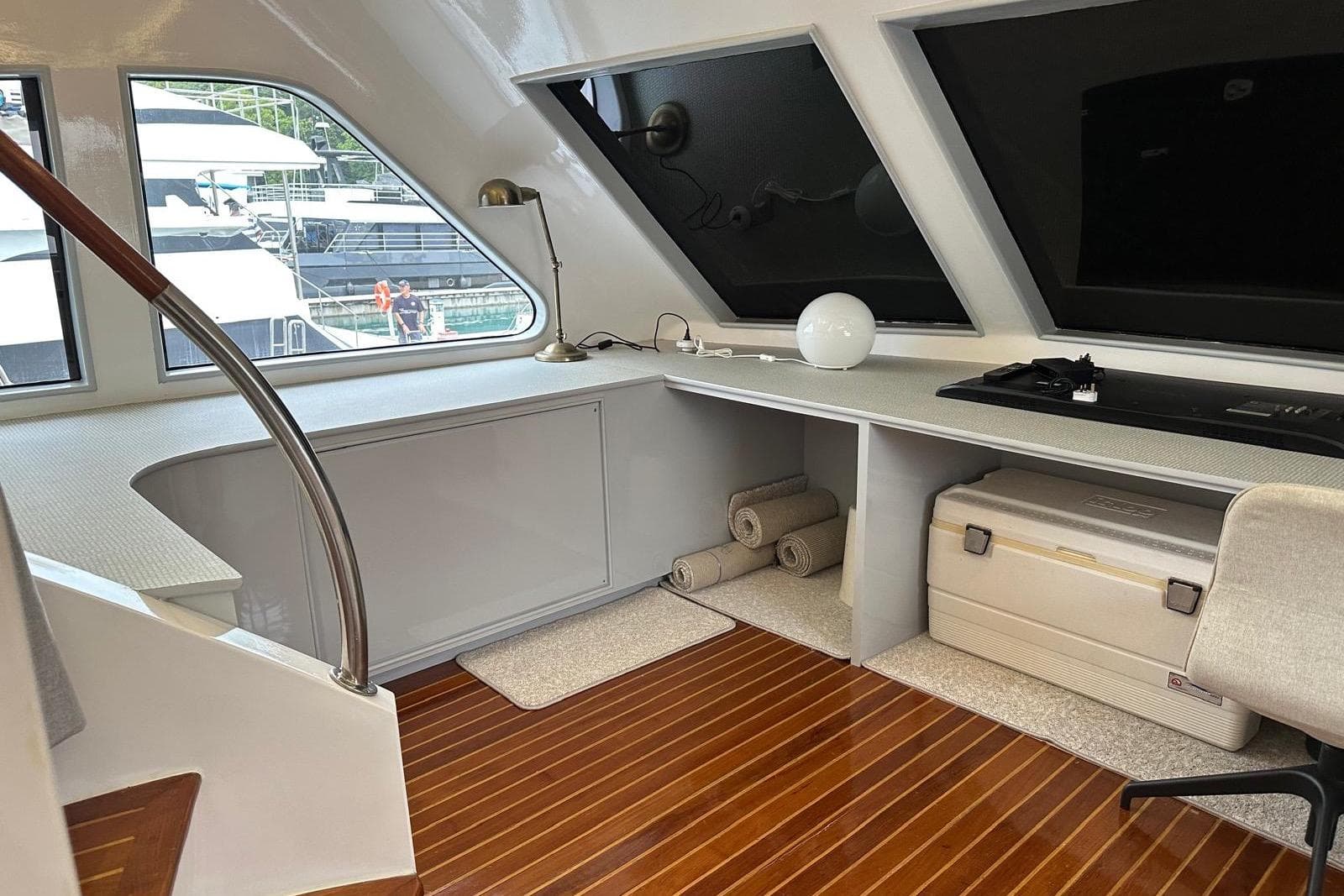 Luxurious interior of 2009 Paceboat 60 with modern desk and elegant wood flooring.