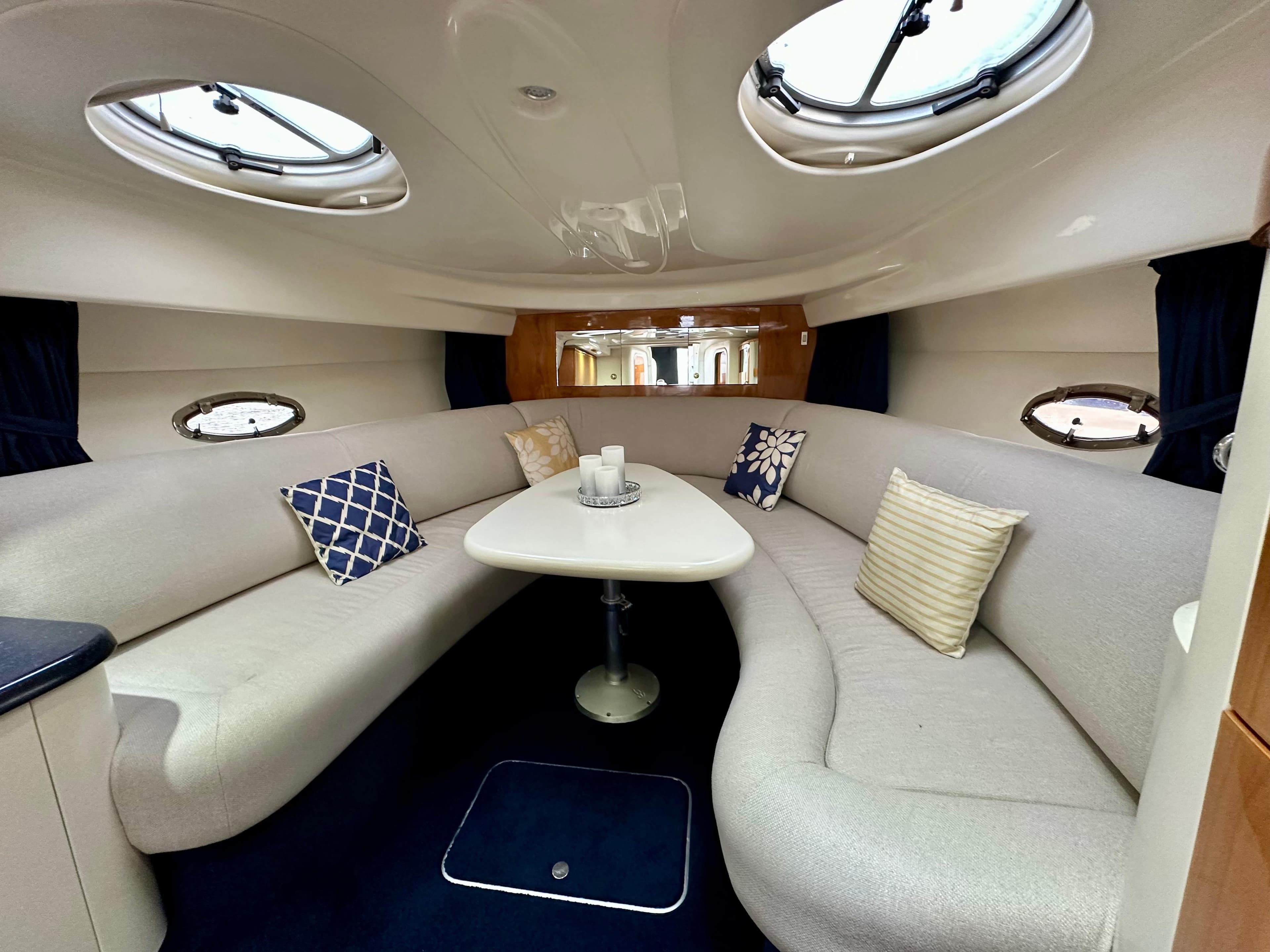 Interior of 1999 Cranchi Endurance 39 yacht with elegant seating and table.