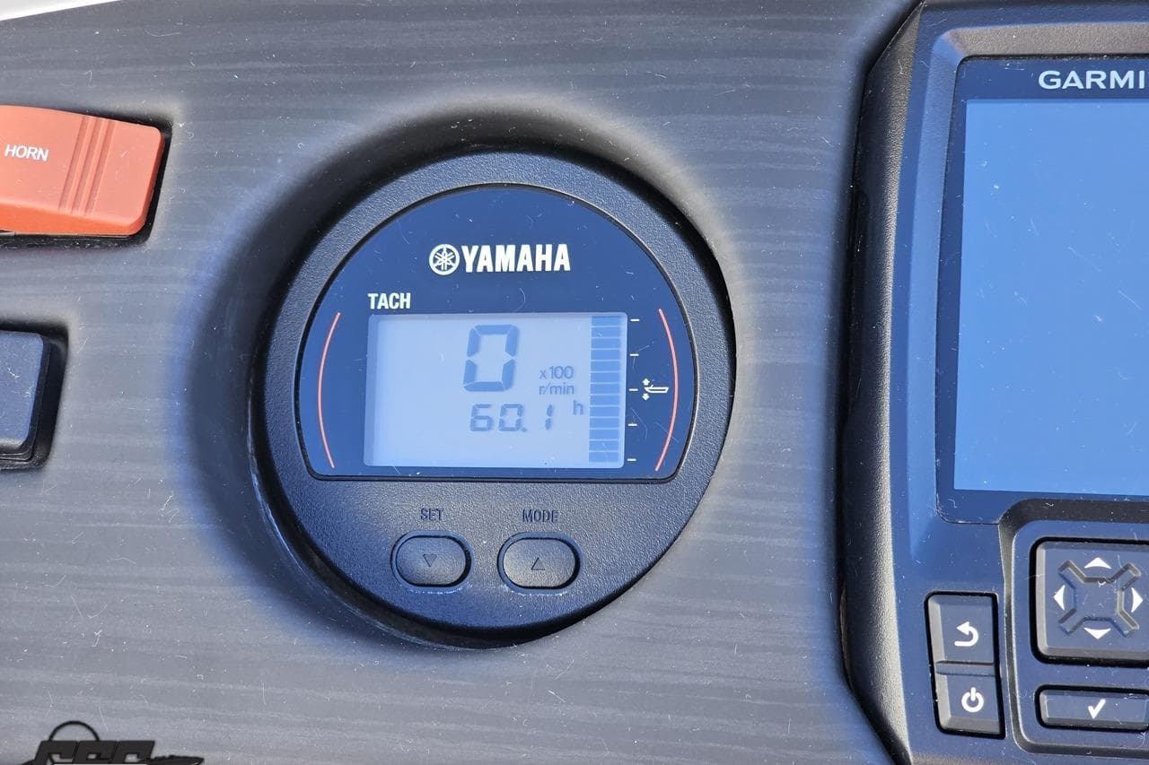Yamaha tachometer and Garmin display on 2022 Bennington SX 21 Fishing boat dashboard.