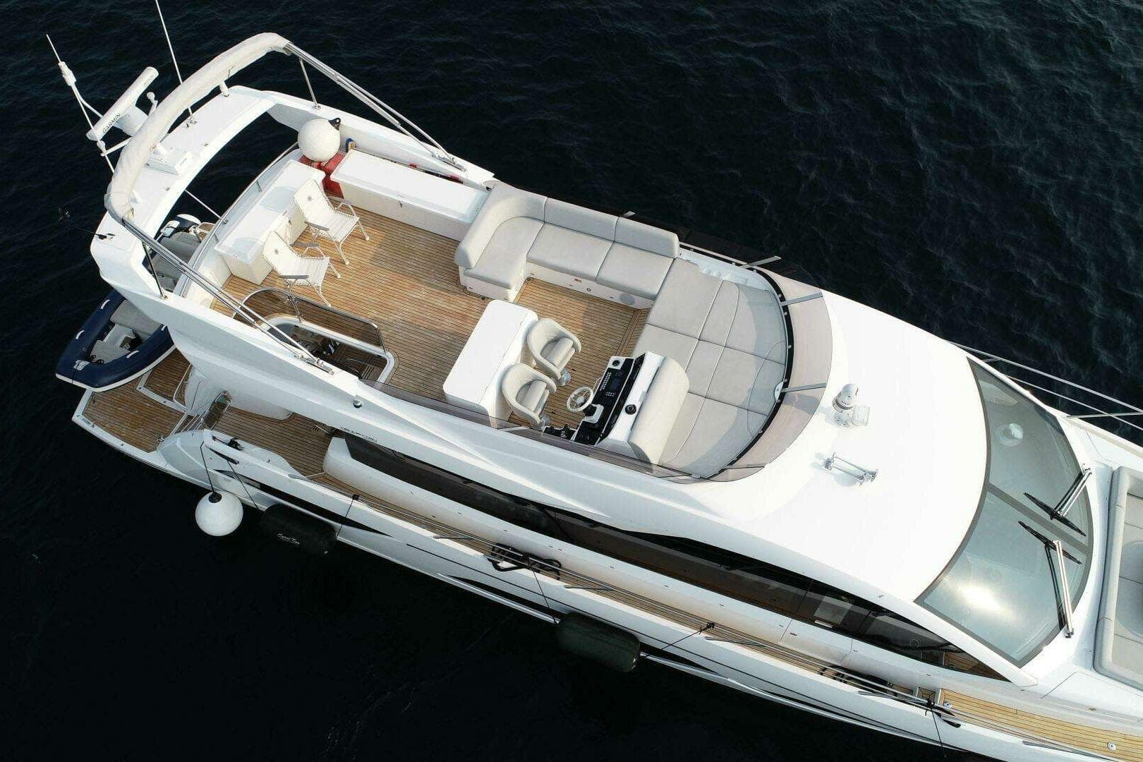 2023 Sunseeker Manhattan 68 yacht, aerial view, luxurious deck and seating area.