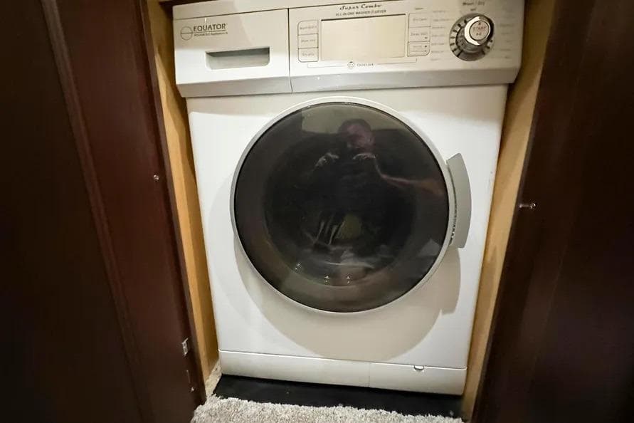 Equator washer-dryer in 2006 Sea Ray 580 Sedan Bridge yacht interior.