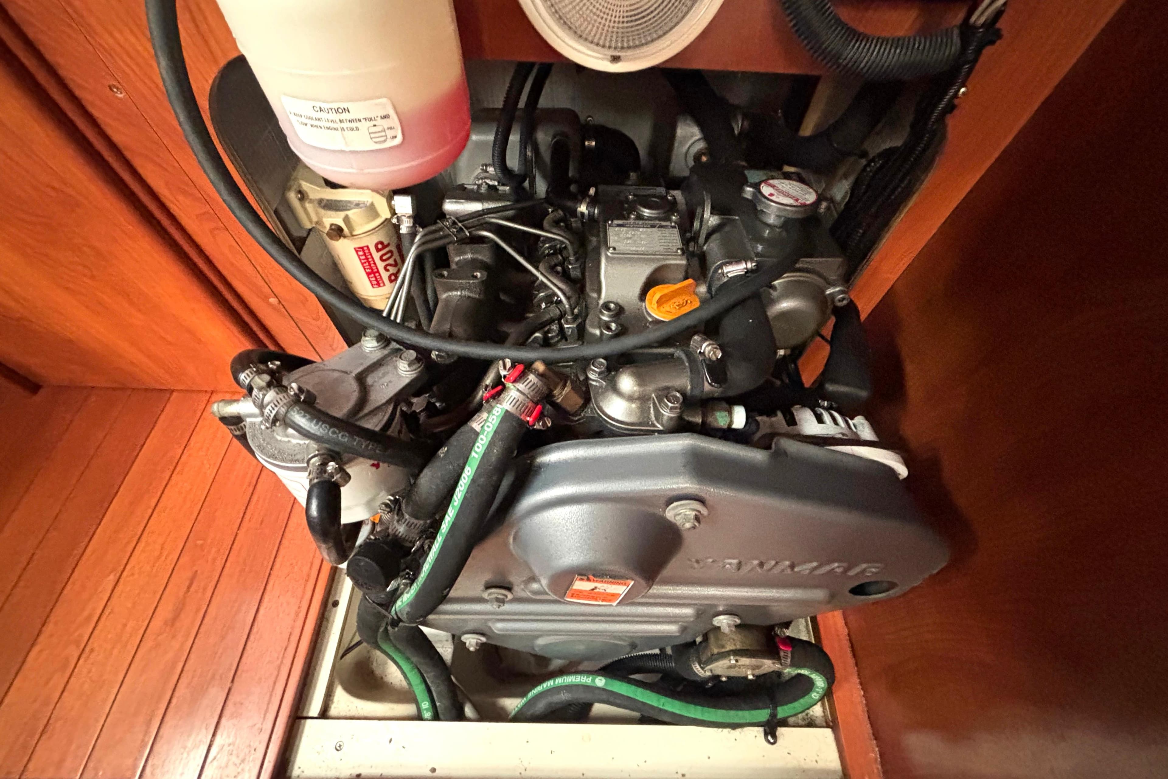 Engine compartment of a 2011 Hunter 39 sailboat, featuring a Yanmar engine.