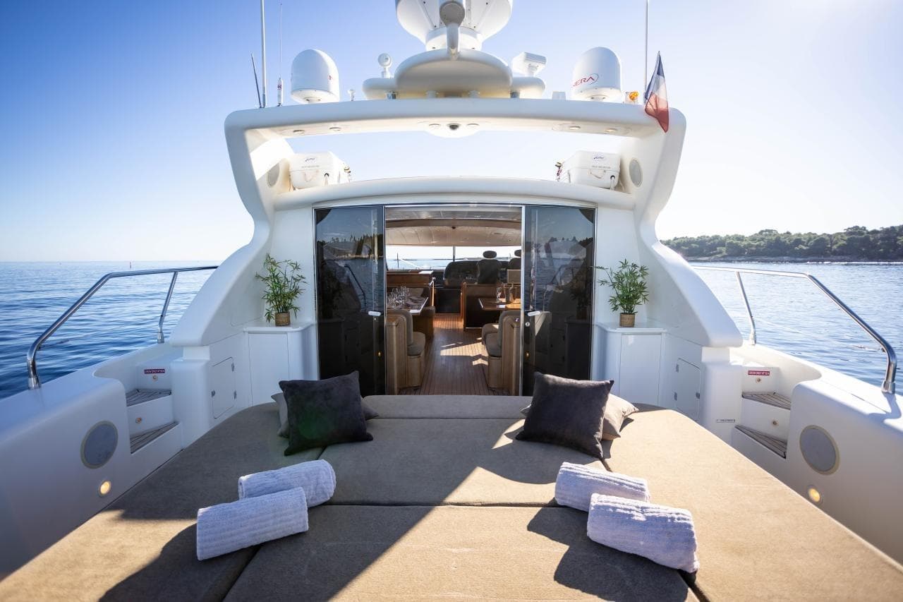 Luxury Leopard 24 yacht deck with sunbathing area, 2005 model, on calm sea.